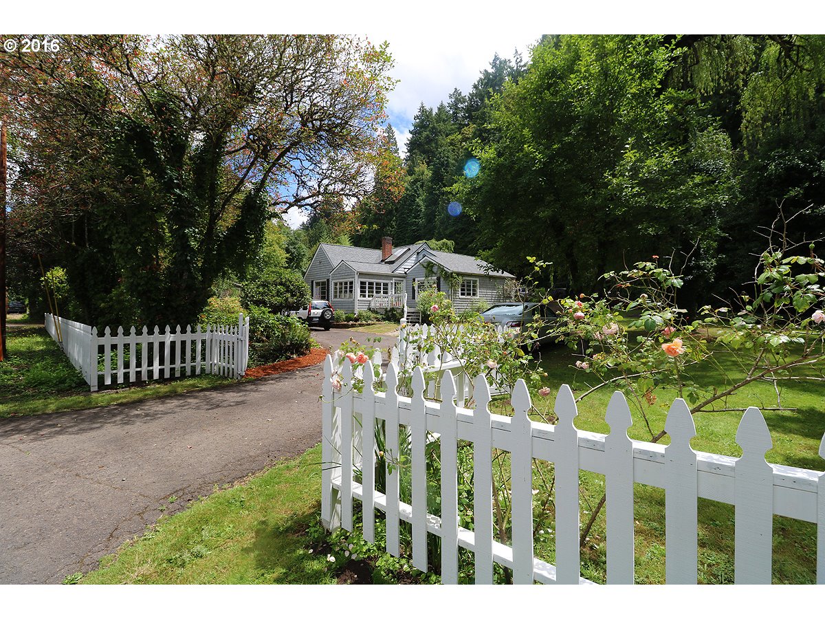 14596 CLACKAMAS RIVER DR Oregon City, Oregon Clackamas River frontage! Awesome historic home on 1.3 acres including a beach on the river, a forest on the hill above & lots of usable level land w/patio-deck-studio-pool & basement! All character & charm intact-yet remodeled thruout! Large sunroom off living-Large kitchen-2 beautiful bathrooms.Lots of big windows & french doors-Huge yard-sunny space,forest behind house on hill & 170FT Clackamas River frontage-access to beach w/trail.