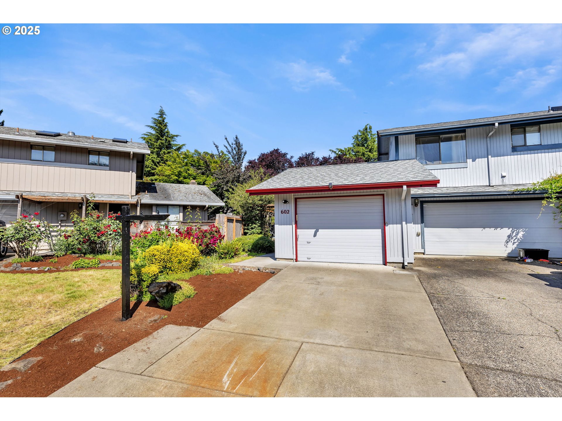 This thoughtfully updated one-level home offers the perfect blend of comfortable living space in a quiet cul-de-sac setting. Step into a bright and open great room with vaulted ceilings, a cozy fireplace, and a built-in book nook or media space.  The kitchen features cabinetry, an island for added flexibility, and plenty of counter space. New laminate flooring runs throughout the home and a tiled sunroom overlooks the backyard, where seasonal plantings add vibrant color during the warmer months. The spacious primary bedroom includes direct access to a covered deck, hot tub, and enclosed sunroom—creating a private space for year-round enjoyment. A well-designed layout and tasteful upgrades make this property one to see.