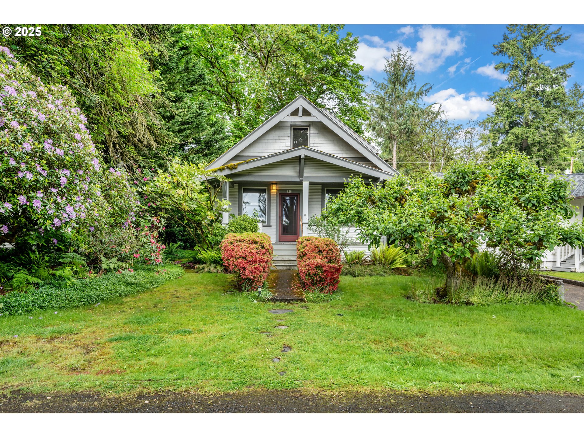 An exceptional opportunity to live in one of Lake Oswego’s most sought-after neighborhoods. Nestled in the heart of the iconic First Addition, this charming home offers unbeatable access to shopping, dining, parks, trails, the elementary school, public library, farmers market, and more—all just minutes away. The home features a welcoming covered front porch and a spacious main level with high ceilings, a formal living and dining room, and a bright kitchen with a cozy eating nook. Two main-level bedrooms share a Jack and Jill bathroom, and there’s also a dedicated home office for added functionality. Upstairs, you'll find a large vaulted non-conforming bedroom, a versatile bonus room, and a full bathroom with walk-in tile shower and skylight. A large unfinished basement includes laundry facilities and offers ample storage or potential for future expansion. Situated on a level 6,000-square-foot lot, the property also includes an oversized one-car garage with alley access. Whether you're looking to restore the home's original old-world charm, expand its footprint, or build new, the location and potential are truly unmatched.