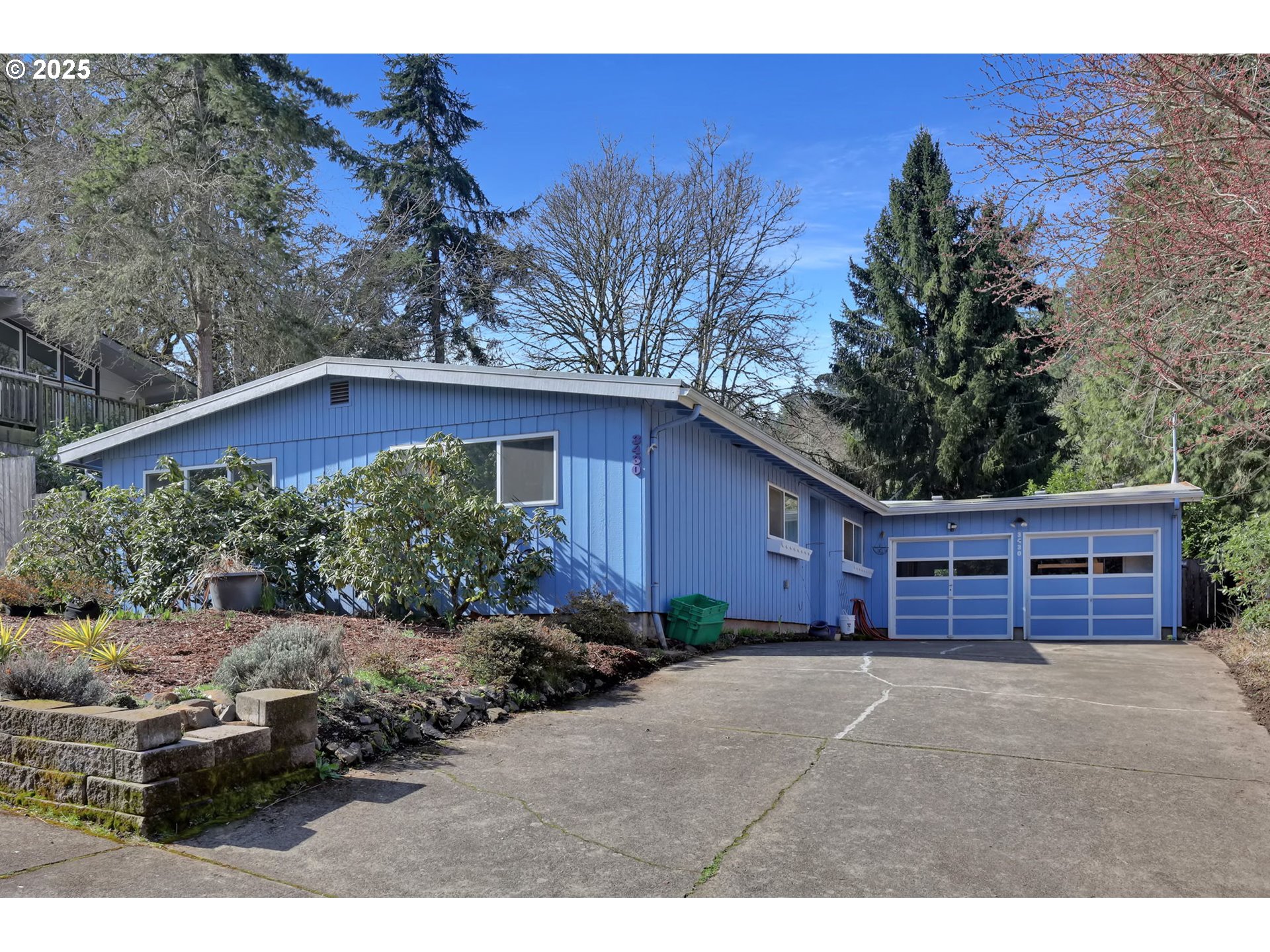 Sought after one level home in South Eugene! This home offers an updated kitchen with granite countertops, new cabinetry and stainless steel appliances. There is a large living room with a pellet stove, ductless heat pump and brand new carpeting and an equally large dining room with fireplace and a slider to the private back yard with a covered patio for dining and relaxing. One bathroom was recently remodeled and all the incoming waterlines were replaced in 2019. The membrane roof is from 2012 and the electrical panel is from 2020. The large, extra deep garage makes a great shop or plenty of room to park cars/toys. The yard is lovingly landscaped with spring about to bloom!