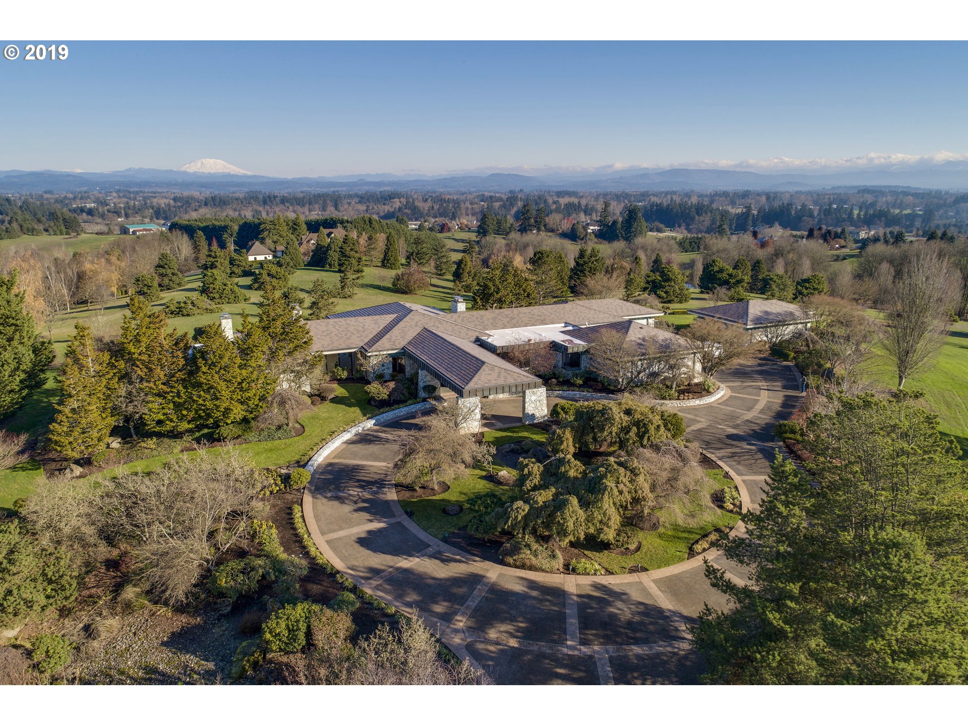 21011 17TH CT NW Ridgefield, Washington Contemporary 7,553sf Estate on 20 gated acres in Ridgefield w/3 mountain views. Single level, 3bed/4.5 bath, open plan w/floor-to-ceiling windows thru-out. Marble floors, light wood, copper & stone accents. Designed by award winning Steven Chase. Entertainers kitchen w/Butlers pantry connects to casual/formal dining rooms. Detached studio w/bath. Beautiful grounds with mature trees. Within 20/30 mins to PDX airport, Vancouver/Portland.