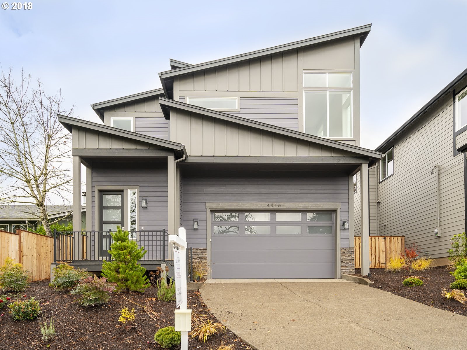 4416 RIVERVIEW AVE West Linn, Oregon Brand new move-in ready contemporary! Spacious, open layout with high end finishes. Modern wide plank hardwoods, quartz counters, vaulted master with hip barn door leading to luxury master bath & walk in closet. Two car garage, fenced backyard with covered patio for year round entertaining! No HOAs and great schools!