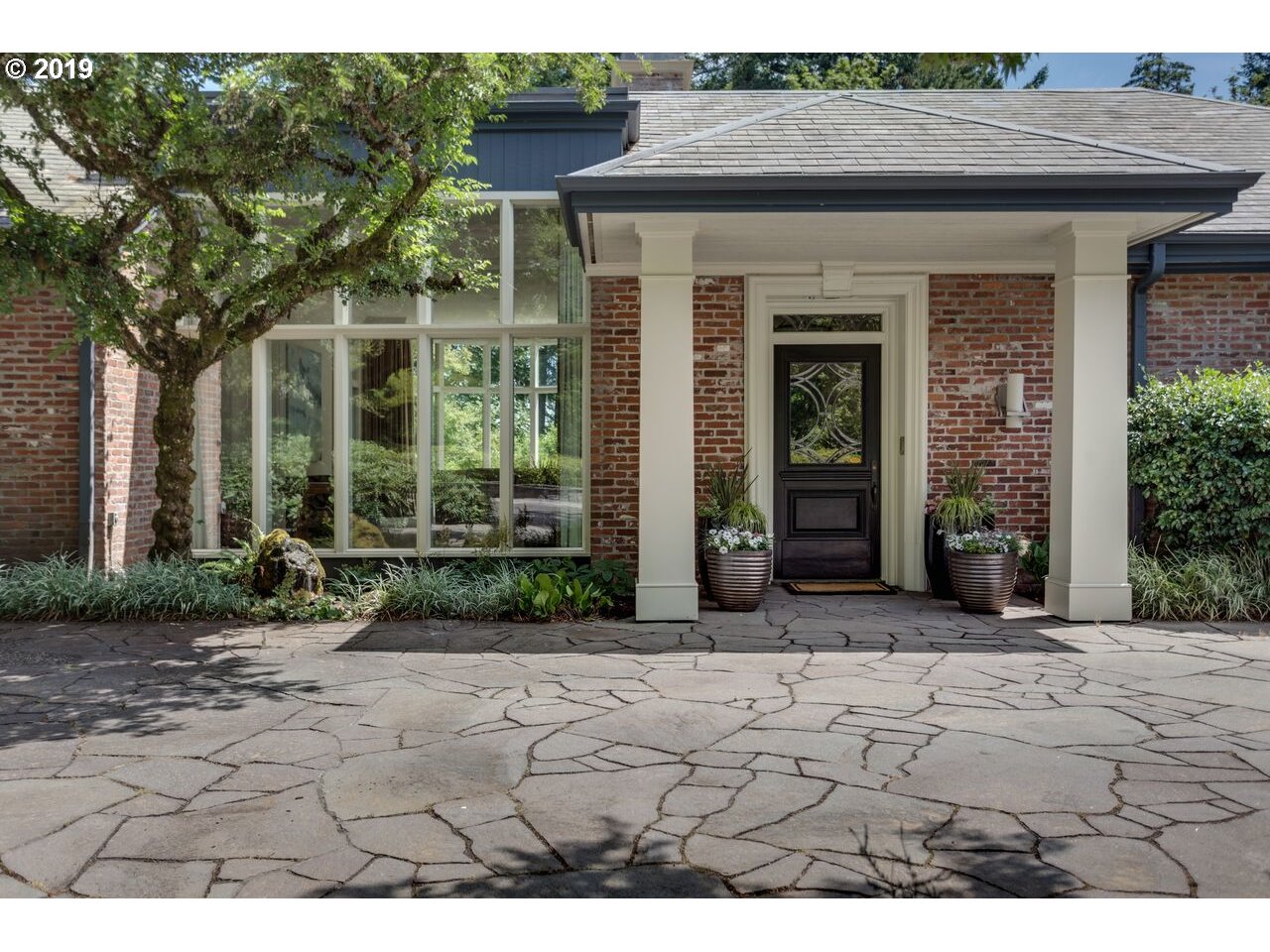 11728 SUMMERVILLE AVE SW Portland, Oregon Perched on a rare & private 2.19 acre lot with tennis courts. Contemporary Dunthorpe estate with main level living. Update with designer finishes, high ceilings, walls of windows & light filled rooms. Expansive verandas & lawn for entertaining. Barbara Fealy grounds & gardens. Over 7,500 SF, 5 bedrooms, 6 full & 1 half baths. Wine cellar. Lower level could be separate apartment or play area with movie room. Desirable Riverdale Schools.