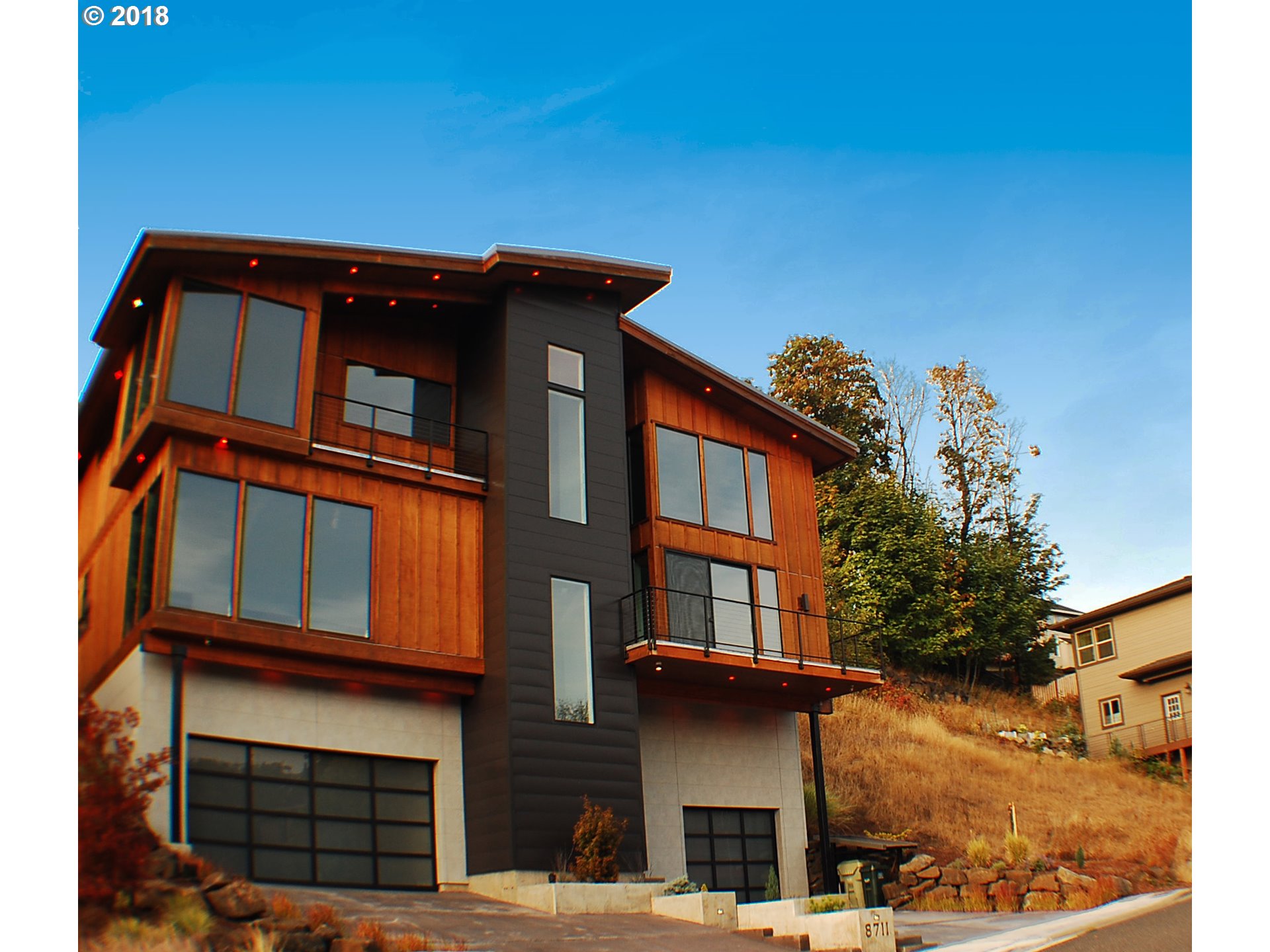 8711 SAVOY LN NW Portland, Oregon $420K Price Drop! Masterfully built by Grun Homes. The extraordinary attention to design and detail is evident in every element. Main level offers Dining, Great Room, Media Room and spectacular Gourmet Kitchen. 3rd level features stunning Master Suite with fireplace, balcony, LUX closet and spa-like luxury bath along with 2 additional bedroom suites. Enjoy ALL the luxuries of a Custom Built w/out the wait. See attch. Specs and Video.