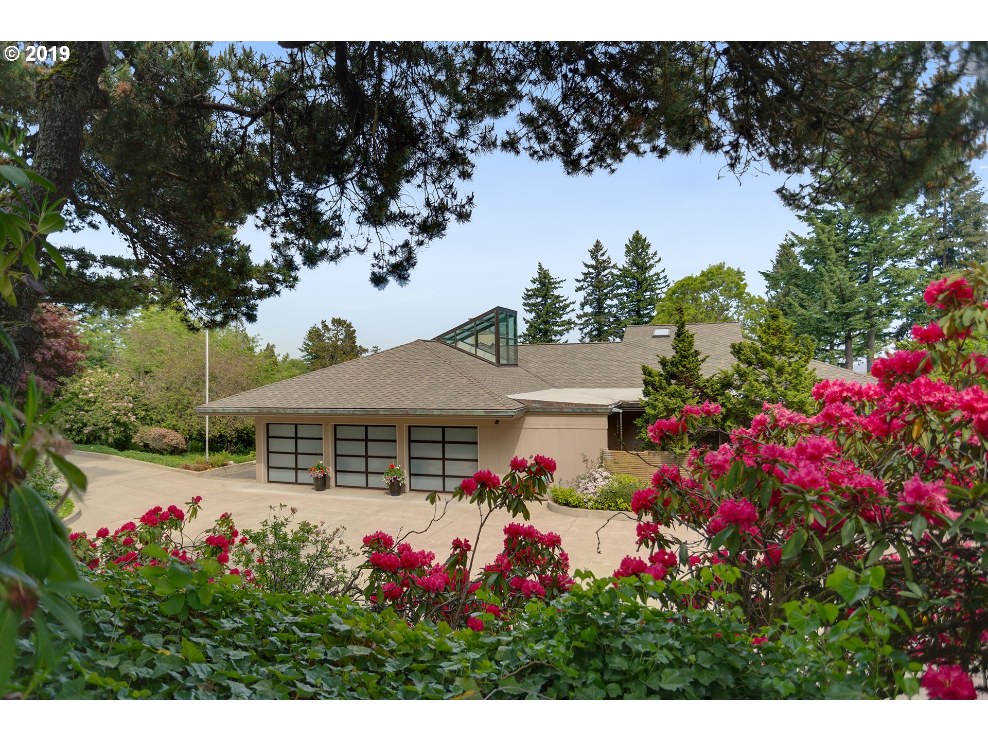 18325 CRESTLINE DR Lake Oswego, Oregon Midcentury Modern hilltop masterpiece with just the right touch of Pacific Rim aesthetic. From the peaceful entry courtyard with reflection pond throughout this beautiful Doug fir paneled home a calming feeling of solidity and quietude fills your senses. Main master, collector's dream garage, incredible lower level with spacious separate living area.