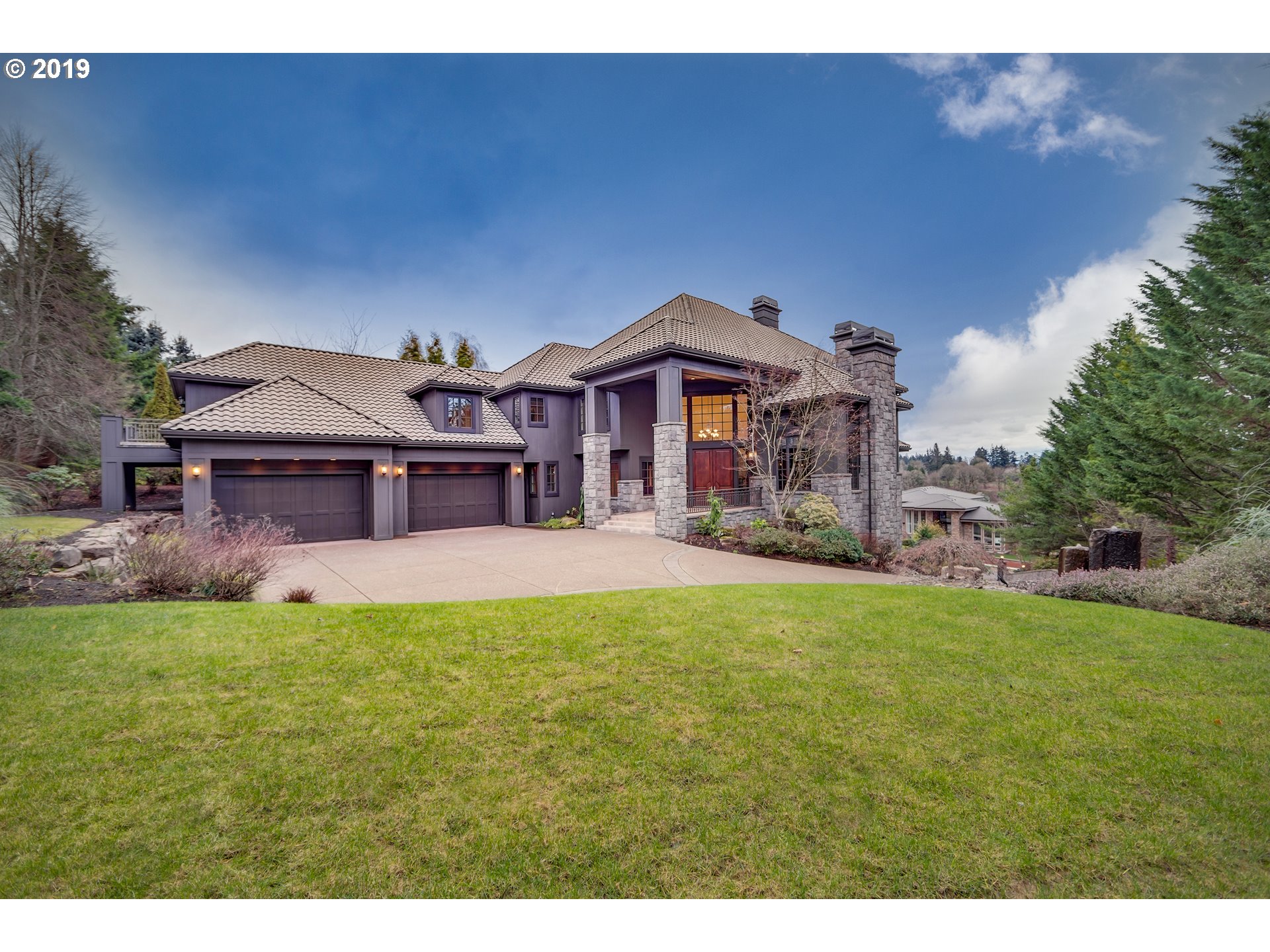 2665 LORINDA LN West Linn, Oregon Major renovations and updates have transformed this already outstanding Mt Hood view estate on a half acre into a light-filled masterpiece which elevates the lifestyle of its' fortunate homeowner. In the intimate gated LeChevalier community, over 12,500 sq ft of fine millwork, cherry hardwoods, spacious cook's kitchen, elevator, 5 bdrms, 7 full & 2 half bths, gorgeous basalt stone siding and over 3,000 sq ft of mountain view terraces.