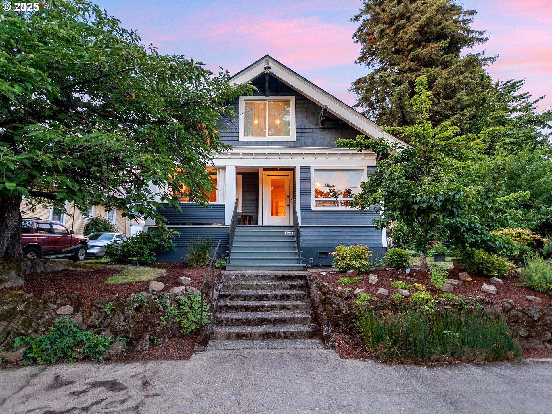 Rare opportunity to own an impressive craftsman with separate living quarters plus an extra buildable lot in the heart of SE Portland. Enjoy the convenience of walking to New Seasons and cherish a close-knit community with neighbors helping neighbors.  Splendid curb appeal along with mature, fruit bearing tress and lots of room to garden. Relaxing, private front porch offers a glimpse of neighborhood activities and is the perfect welcome home. Step inside to a bright, cheerful living room with its cozy fireplace with clear fir mantle and Pratt & Larson field tile in a classic Pacific Northwest color palette. Southern exposure light floods through floor-to-ceiling windows. French doors separate the living and dining spaces. Spacious dining room with period built-ins is perfect for hosting family and friends. Three main level bedrooms and a bathroom with subway tile and fir flooring. The upstairs studio features abundant light via numerous skylights. This space offers a practical kitchenette, cork flooring, laundry, bath, and a sunroom overlooking the spectacular front yard cherry blossom tree. Full, clean basement with its own laundry, bathroom, and outside entry awaits your finishing touches. Recent improvements include a new tear-off roof, paint inside and out, and a heat pump (A/C). Your favorite award-winning restaurants or coffee shops along Hawthorne and Division, plus beautiful, nationally renowned Mt. Tabor with its hiking trails, dog park, picnic and play areas, and city views are just beyond your door. Separate tax lot features an amazing treehouse, sauna/shed, patio, and the driveway (see MLS #161224725). Preference will be given to a buyer seeking to purchase both the main lot and the separate lot. Come see this home. Fall in love with this home and all it has to offer.