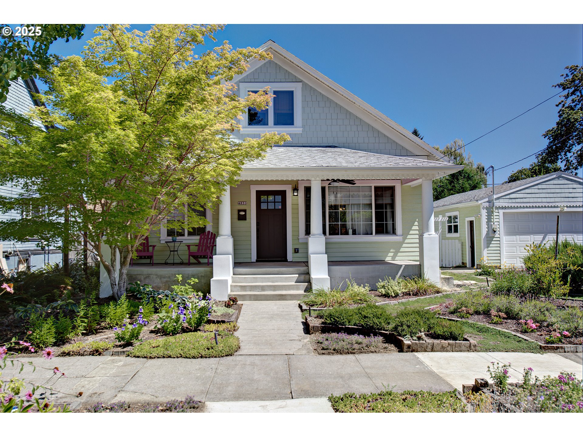 "1908 Bungalow lovingly restored for modern living and entertaining." Elevated elegance awaits in North Portland. Discover a meticulously transformed 1908 masterpiece, where classic charm meets contemporary luxury. This expansive 3,395 sq ft residence has undergone a breathtaking, high-end remodel of its main floor and kitchen, designed for sophisticated living and effortless entertaining. Gourmet Dream Kitchen: Indulge your culinary passions in a  state-of-the-art kitchen featuring custom cabinetry, quartz countertops, and Gorgeous Island. Every detail meticulously curated for the discerning chef. Seamless Main Floor Living: Flow effortlessly through generously proportioned living and dining areas, bathed in natural light and adorned with premium finishes. "Perfect for intimate gatherings or grand celebrations. Primary Suite on Main, Office/sewing room on Main Step into your resort-style Backyard oasis. The sparkling, heated inground pool promises endless relaxation and recreation, a truly rare find in the city. Heats to hot tub temps. Chic Outdoor Entertainment: Gather around the inviting outdoor gas fireplace, and over head heaters. Lounge on the bed swing. Great for cool evenings and al fresco entertaining. Thoughtfully landscaped grounds complete this exceptional outdoor living experience. Income Generating / Multi-Generational Suite: Discover the incredible flexibility of the lower level, featuring a full kitchen, living room, and two versatile rooms with a full bath. This self-contained space has a history $1,500/month in rental income, offering a good mortgage offset or accommodations for guests, extended family, or a dedicated home office suite. Car enthusiasts and hobbyists rejoice! Enjoy the convenience of a 2-car extra-deep garage/shop with 220 Electrical. All this a few blocks from Columbia Park, The Chill-N-Fill, Living Room Wines, shopping, restaurants, transit & more. Open house AUG 2nd & 3rd Noon- 3Pm [Home Energy Score = 3. HES Report at https://rpt.greenbuildingregistry.com/hes/OR10240047]