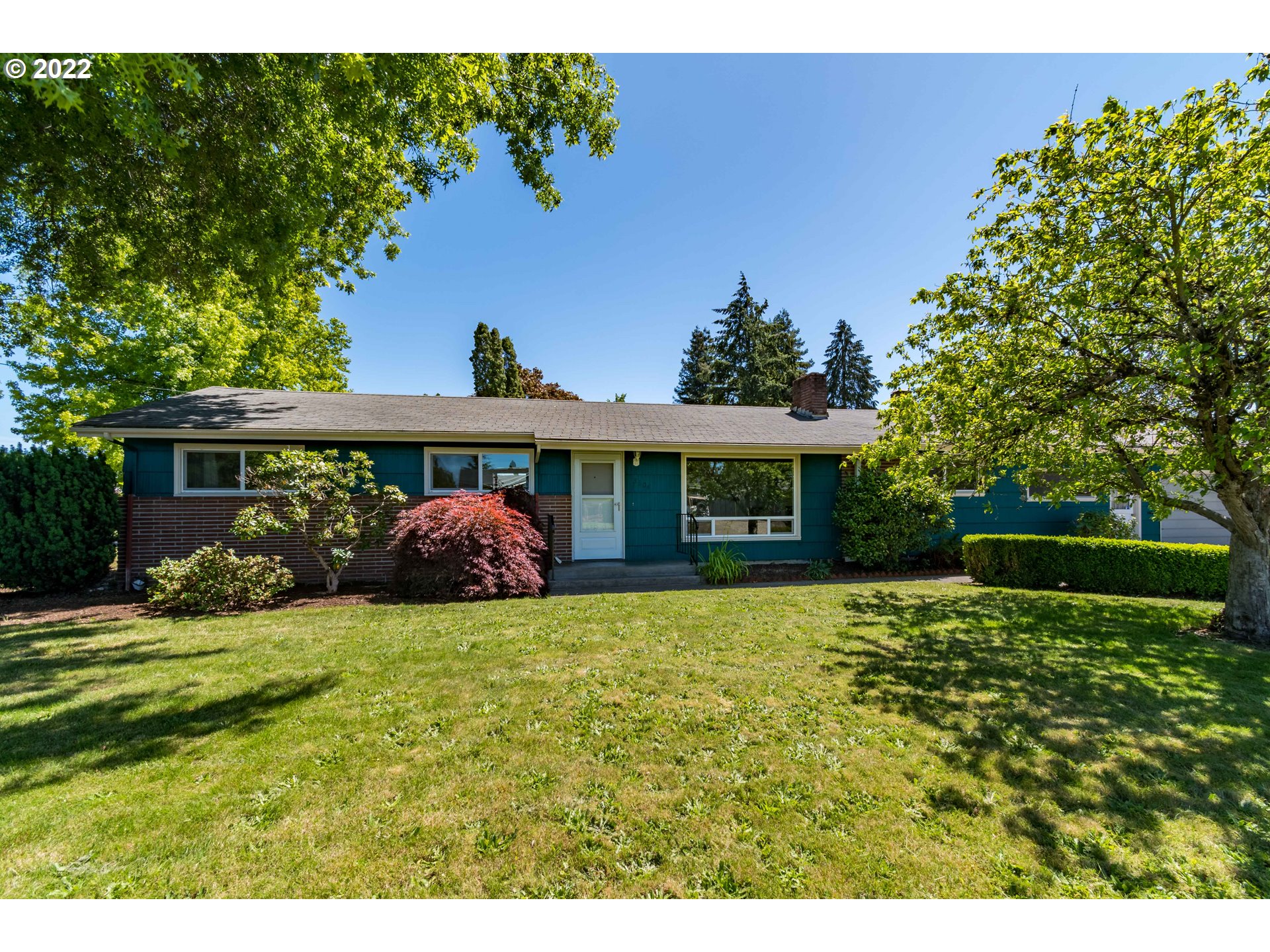 Charm-Filled 1950's Ranch Style Home! Hardwood floors throughout, living/dining w/ fireplace & tray ceiling. Spacious kitchen opens to family room. Vaulted sunroom leads to huge yard...a true gardener's paradise! Mature landscaping, tons of perennials, 1000+ flowering bulbs, magnolia, dogwood, blueberries, too much to list! Potential for RV parking, vinyl windows, ductless w/ 2 heads, newer plumbing and sewer lines, large garage w/ drive thru to back.