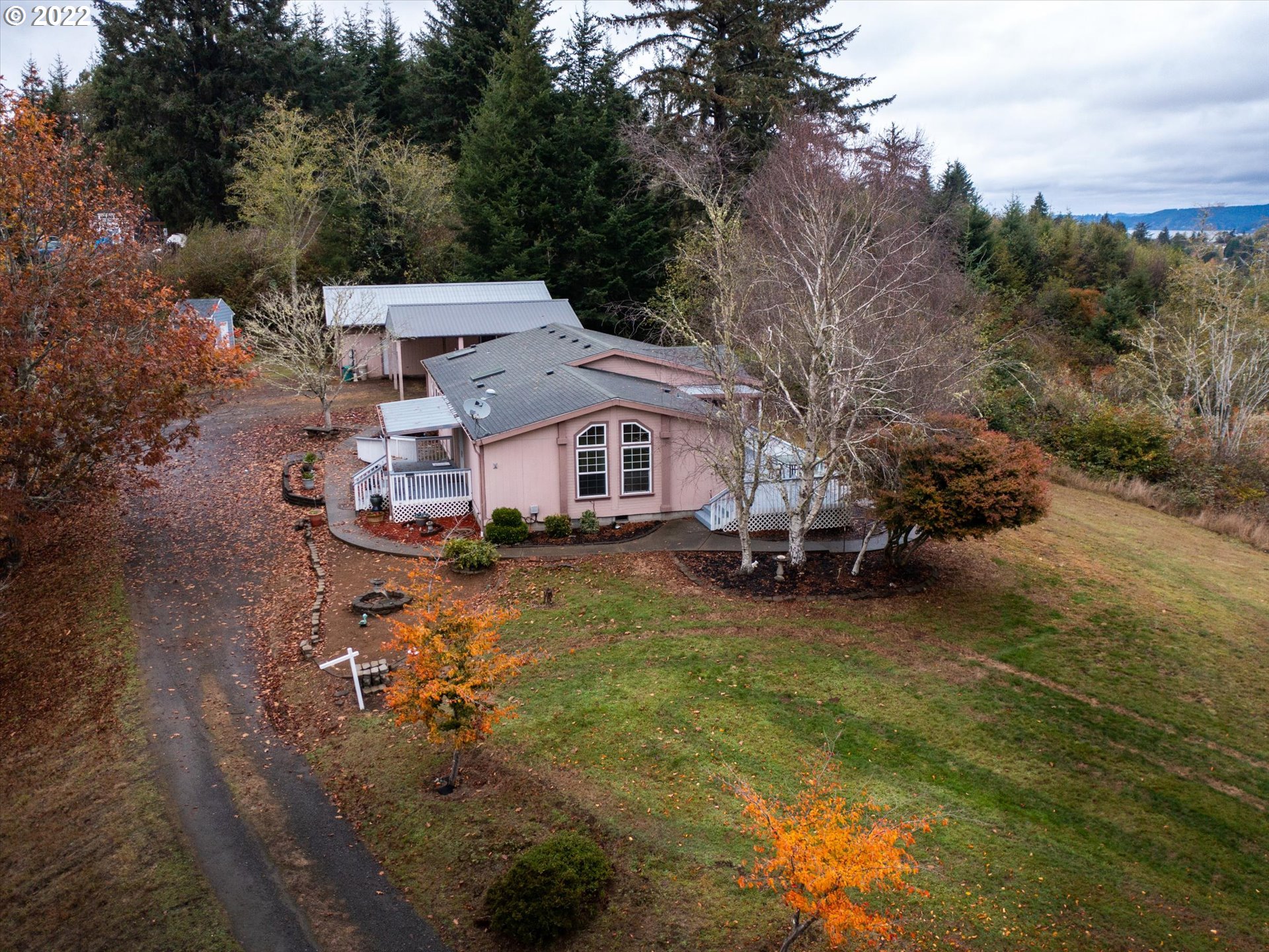 Beautiful Hilltop location overlooking Isthmus Slough. Spacious manufactured home with huge40x30 shop and 30x20 covered area. Mature fruit trees, deck and covered patio. Huge master bedroomwith walk-in shower and jetted tub. Private and peaceful - your own Coastal retreat!