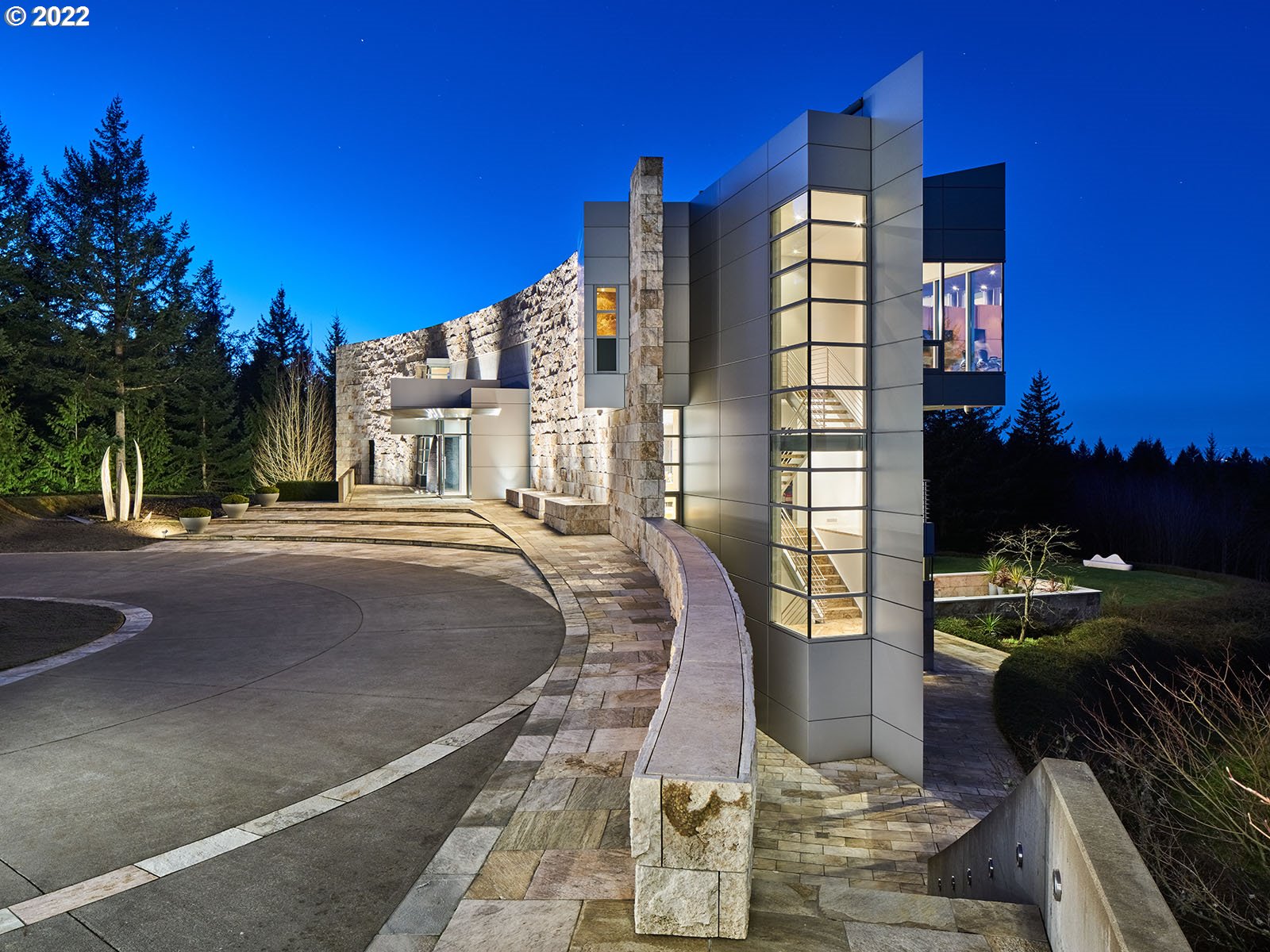 A masterpiece of light & design, this architecturally significant Pacific NW contemporary is filled w/incredible statements, offering the perfect balance between function & form. Creative & spectacular. Unprecedented attention to detail. Views, privacy, gated, 9.74 acres, close proximity to airports and city, adjacent to Forest Park, 6 car garage, pool&spa, music room, guest house & a myriad of other exceptional offerings, create a unique opportunity for the discerning life enthusiast. Awesome!