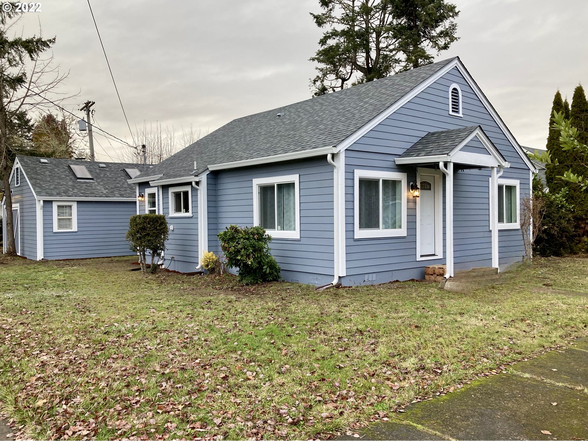 This is a charmingly remodeled home, from top to bottom! Most everything is new, from roof to windows, from the kitchen to the bathrooms, from the flooring, to the front porch. Brand new high end appliances elevate the kitchen and the light & bright finishes throughout the home will brighten up our rainy days. The attached shop/garage has a plumbed sink and built in shelving, convenient for a variety of uses; this is the home you've been waiting for!