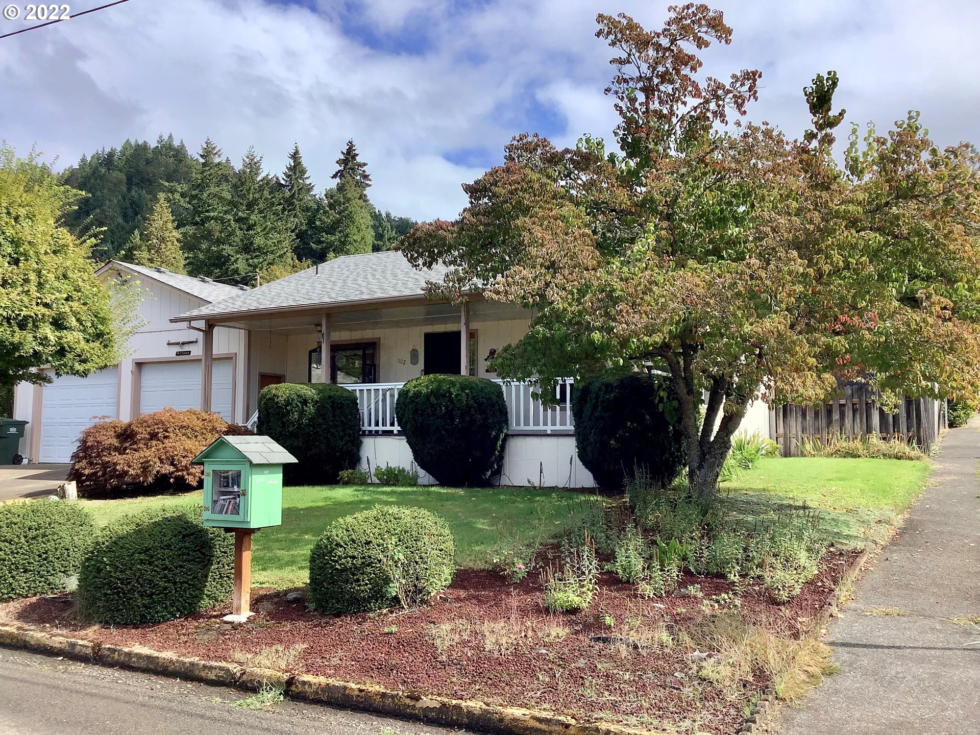 Well maintained home on large corner lot. Great division of space with large primary en-suite on one side and additional bedrooms on the other. This home is a gardener?s haven. Raised beds filled with flowers, grapes, tomatoes, and room to plant veggies. Yurt in the back yard is used as a sewing room but could serve as a man cave or she shed. Extra storage in garage beyond parking, tool shed, covered patio and so much more! Located by the school?s this would be an excellent starter home!