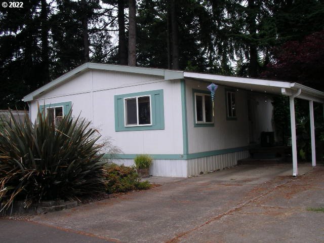 Come enjoy this park like setting just across the road from Fern Ridge. Quiet and beautiful location. Home offers, large kitchen, ductless heat pump, newer water heater and beautiful laminate flooring in the living room and bedrooms. Covered parking and storage shed out back. Park provides RV parking/boat storage.