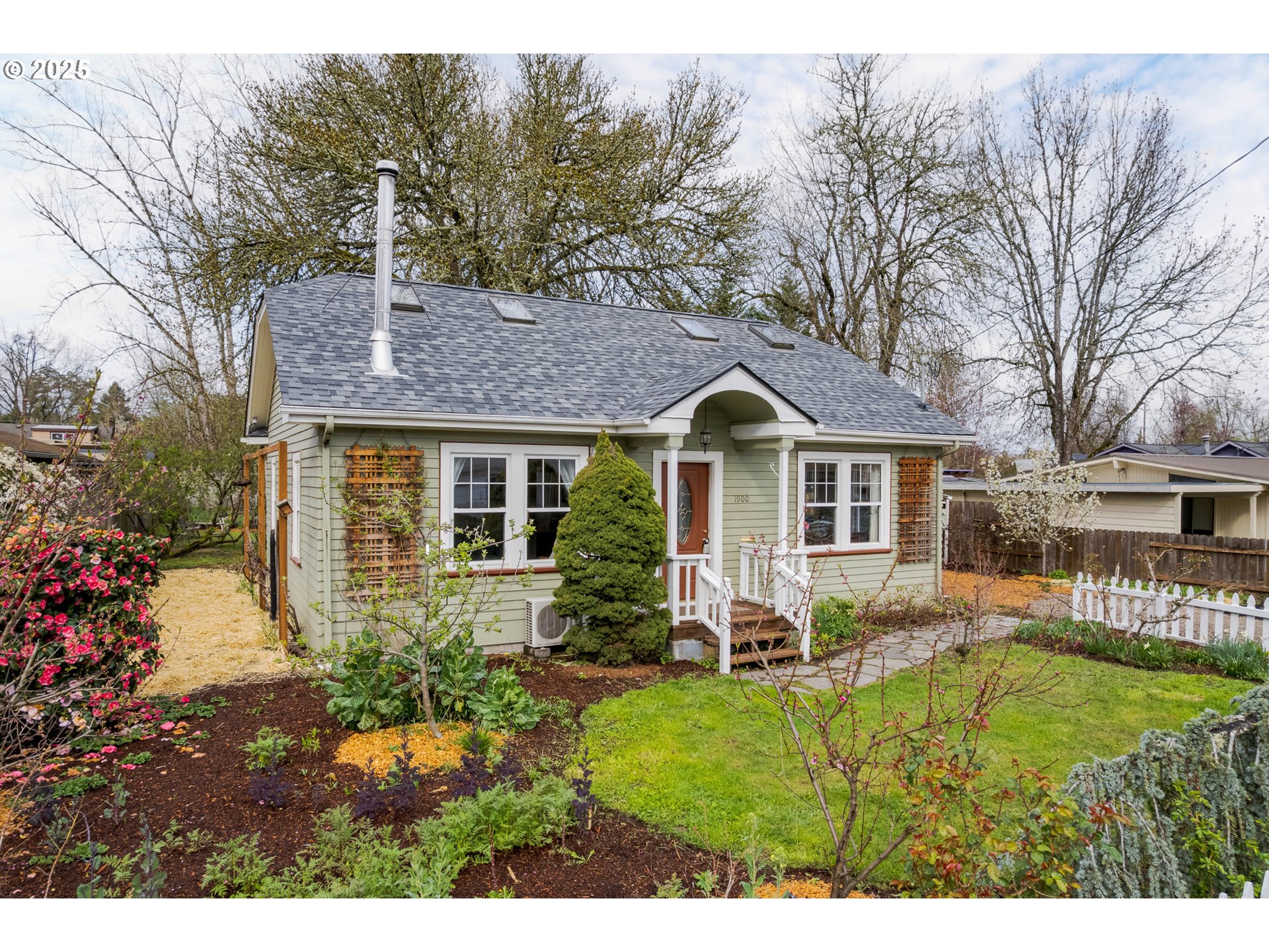 Have you been searching for a move-in ready, South Eugene home with character and an established, organic garden for under $400k? 1900 Garfield fits the bill! Situated on almost 1/4 acre, sunny lot with a white picket fence just west of the Friendly Neighborhood, this well-maintained home features 2 bedrooms + office, 1 updated bath, newly refinished fir floors, ductless heat pump, and brand new roof! Other features include high-end woodstove, updated plumbing & electrical, energy-efficient Rheem water heater, vinyl windows, upgraded attic insulation, new flooring in the bath & laundry room and multiple outbuildings including detached garage/shop, garden shed, tool shed & bike storage. The sweet, chemical-free yard w/ covered patio, deck and pergola is a gardener's dream featuring drip irrigation, raised beds w/ asparagus, several varieties of mature fruit trees (apple, peach, nectarine, pear, plum), prolific grape arbor & berry bushes (black, straw, rasp & blue), spring bulbs, summer perennials, flowering shrubs and sweet smelling daphne, lilac & clematis. With timeless appeal and thoughtful updates, this sweet home is the true trifecta of affordable, charming & move-in ready! Ask your agent for the full description of upgrades & plantings. All appliances and roof warranty are included.