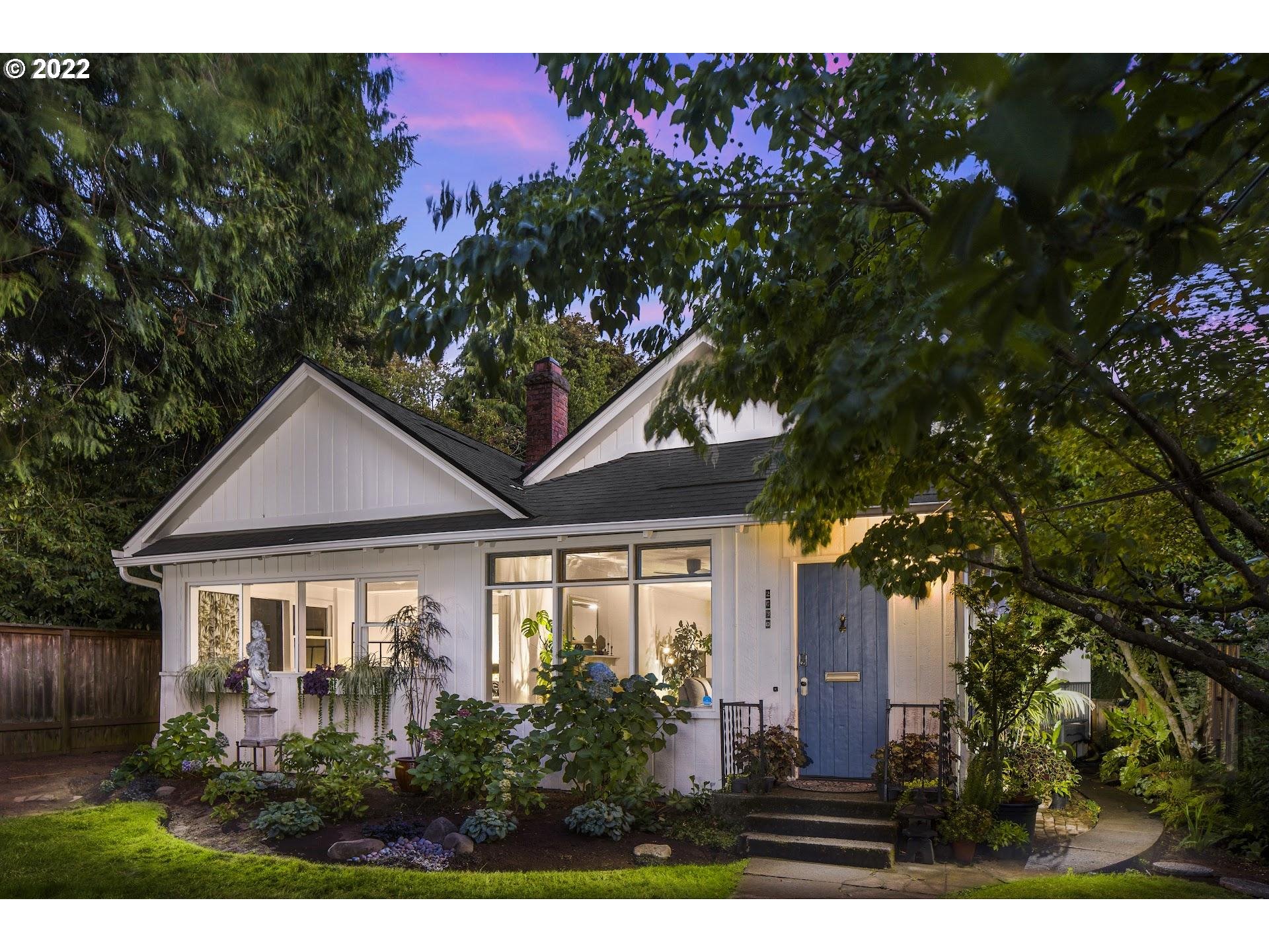 Perched high, this remodeled cottage is tucked in a private setting. Open living/dining, 3 beds, sunroom, spa-like bathroom, partially finished basement for future build-out. Ideal mix of historic charm & modern esthetics: decorative woodwork, shiplap, & beamed ceilings. Updated kitchen w/ eat bar, skylight, subway tile & premium appliances. Private rooftop deck for entertaining. Driveway & parking access through quiet Montgomery St + 3 park spots. Close to downtown & blocks to Washington Park. [Home Energy Score = 7. HES Report at https://rpt.greenbuildingregistry.com/hes/OR10205213]