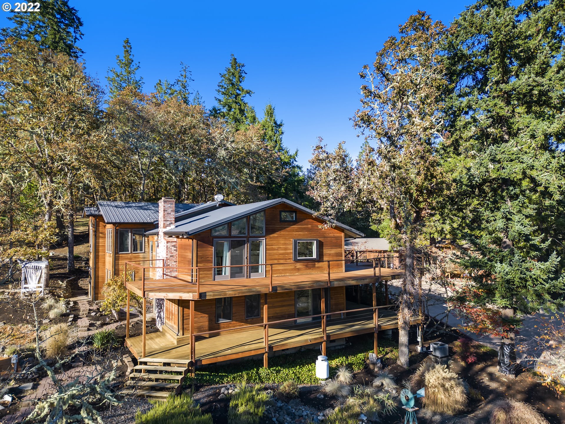 86456 PINE GROVE RD Eugene, Oregon Escape the city to your own private retreat. 10 min to full services & shopping this homestead is nestled in the foothills of Willamette Valley wine country- with a little something for everyone. The open floor plan and the beautiful relationship with the natural world is the perfect backdrop to entertain. Enjoy a dip in the hot tub on a cold starry night, invite friends to play pickleball, bocce or stay in the detached guesthouse. With ample storage options this property is fun and functional.