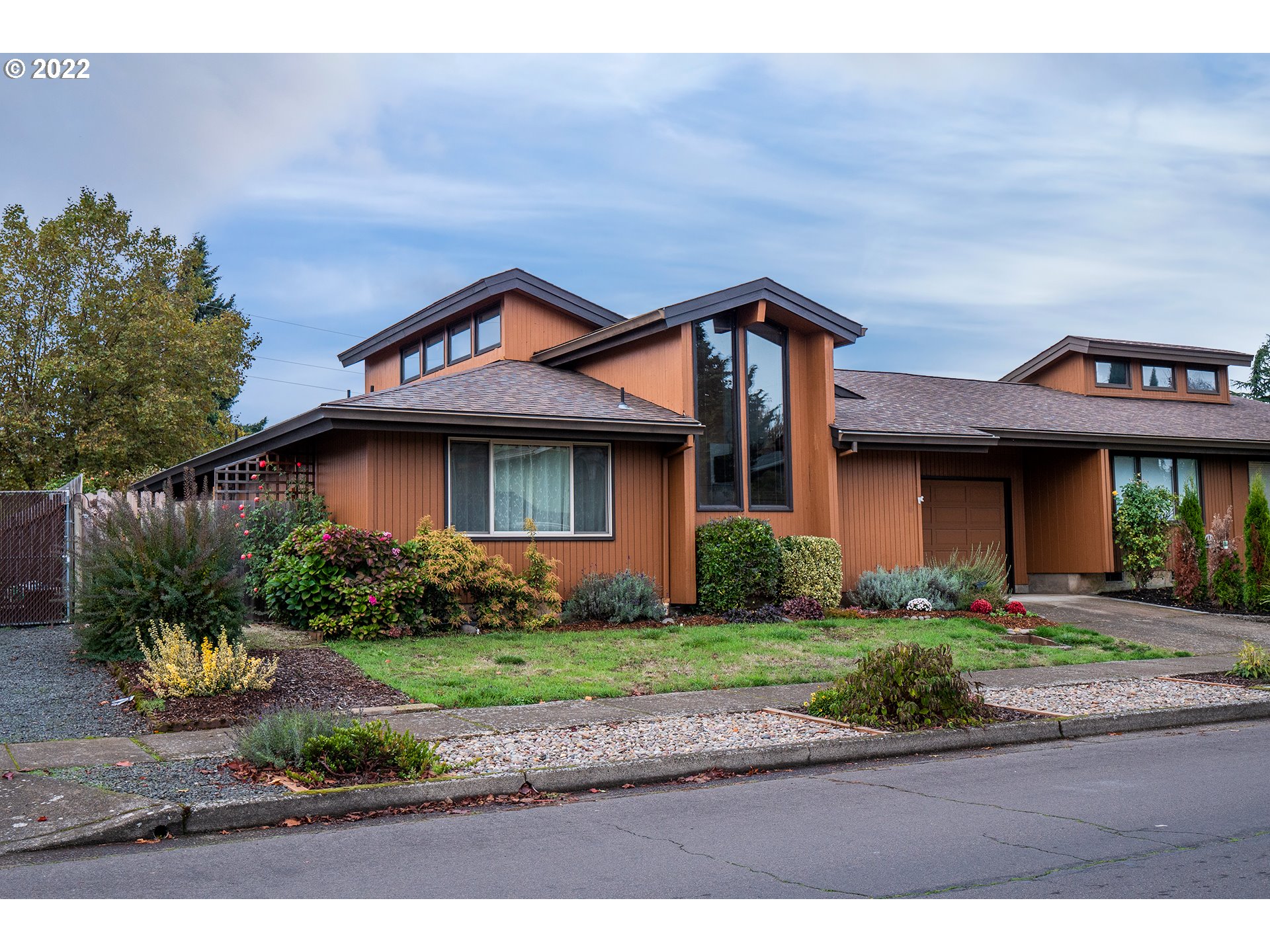 A beautiful and well-constructed tandem home filled with natural light, vaulted ceiling, and open floorplan centrally located in the heart of Springfield and close to Eugene! Quality features include an updated roof in 2014, NEW high-efficiency Daikin forced air heat/cool unit, water heater, new dishwasher + LVP, double pane wood frame windows, insulated garage and attic storage. Enjoy the large primary bedroom looking out into the enclosed patio! Back on market no fault of Seller opportunity.