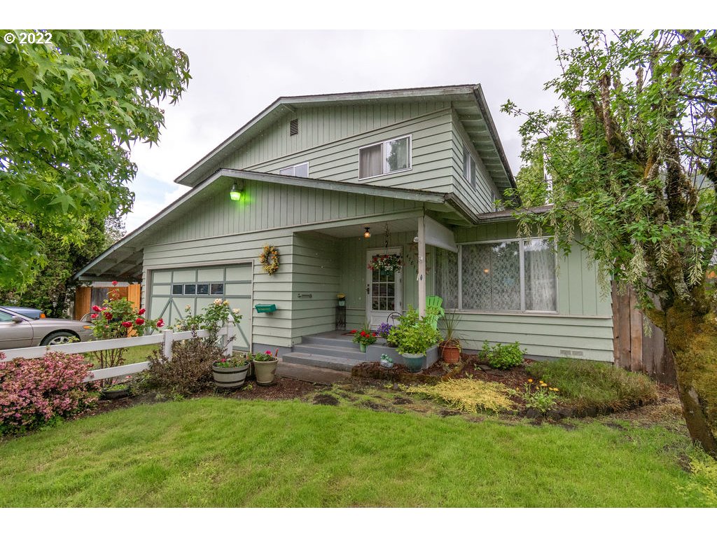 Don't miss this spacious, almost 2000 sq ft, 4 bedroom 3 bathroom house with a large yard on a quiet street. This home can use a some cosmetic updates, but it's been well cared for and seems to have great bones. It has high ceilings, newer laminate flooring downstairs, updated bathrooms, a cozy wood stove and awesome yard with a covered patio and additional deck. The garage is oversized and has high ceilings. There is also separate covered wood storage area.