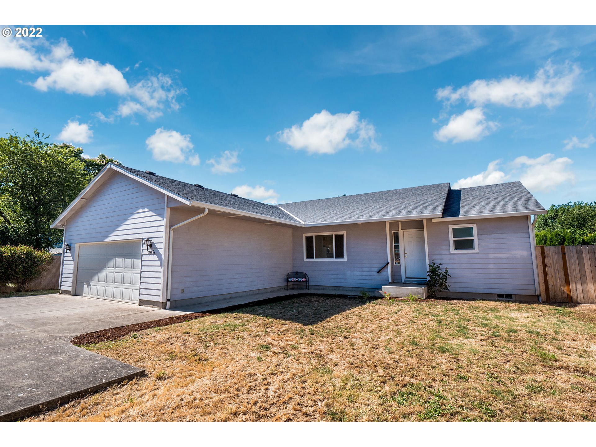 Wonderful private single level home tucked away with its own driveway. Easy to maintain and well built, this home has 3 full bedrooms and 2 baths. Light fills the kitchen and this open floor plan with a great room, dining area and vaulted ceilings. All appliances come with the home including Washer, dryer and extra refrigerator! This home has been cleaned and is ready to move in!