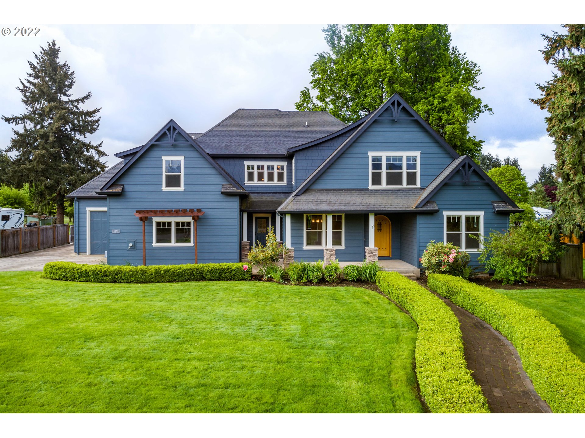 Craftsmanship At Its Finest in This Immaculate Custom Designed Home! Gourmet kitchen w/ granite, cherry & walnut cabs, gas range. Unique vaulted owner's retreat w/ circular entry, spa bath, huge closet. Ipe & cherry floors w/ inlaid Byzantine tile. Light-filled great room w/ stone fireplace + media rm w/ onyx wet bar. Central Vac, 2 HVACs, 2 RV Pads, 2 Car Garage + huge RV garage & urinal! Fenced/landscaped yard w/ shed, sprinklers, covered porch & patio, across from orchard.