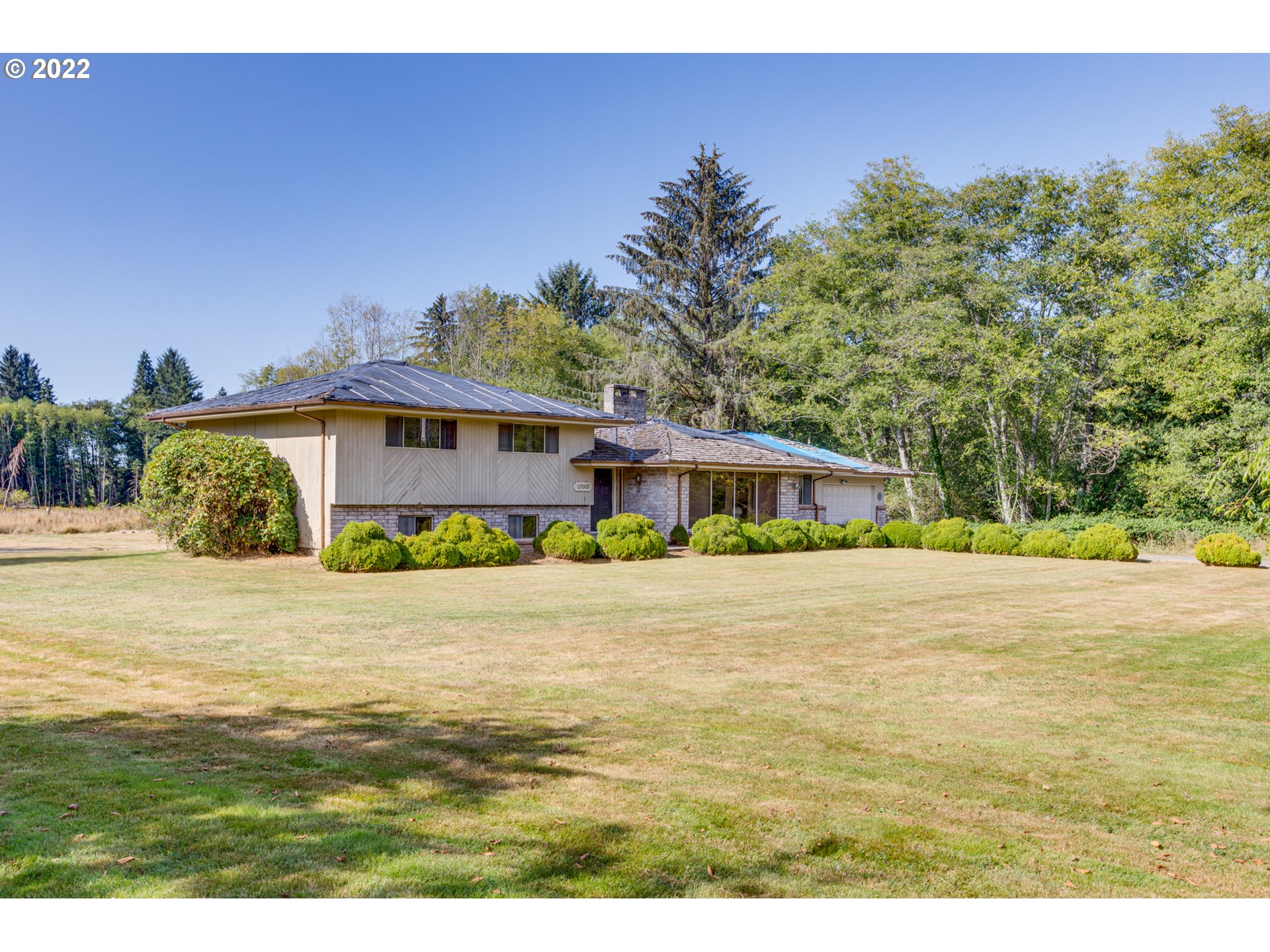 42459 Hillcrest LOOP Astoria, Oregon Need Space and privacy? You will appreciate this day ranch w/mid modern charm with 3BR & 2.5 BA, large kitchen, dining area, 2 fireplaces, a barn with two stalls and a corral area for horses or livestock, lots of room for a garden. Land area is 11.92 Aces with the 2 tax lots. Forest portion of property has been replaced last spring. Note: Needs new roof. Sold AS IS