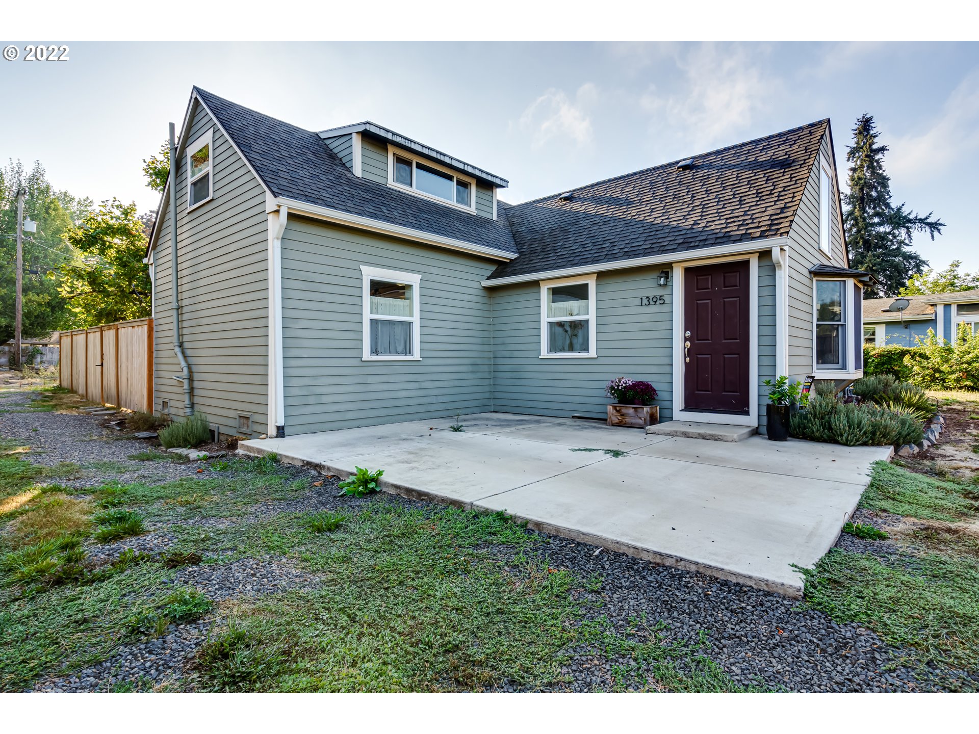 1395 SUNNY DR Eugene, Oregon Don't miss this charmingly updated vintage house perfectly updated for the way we live today! A lovely window seat welcomes you to the large living room. Curl up and read a book by the gas stove before enjoying a dinner made in the gorgeous kitchen. Updated laundry room hides a half bath! Primary bedroom is nestled upstairs for privacy, but has a jaw dropping walk-in closet! Bonus loft is accessed via upstairs bedroom- what is your need? Office? Storage? Stage? Enjoy sunset from the sweet deck!