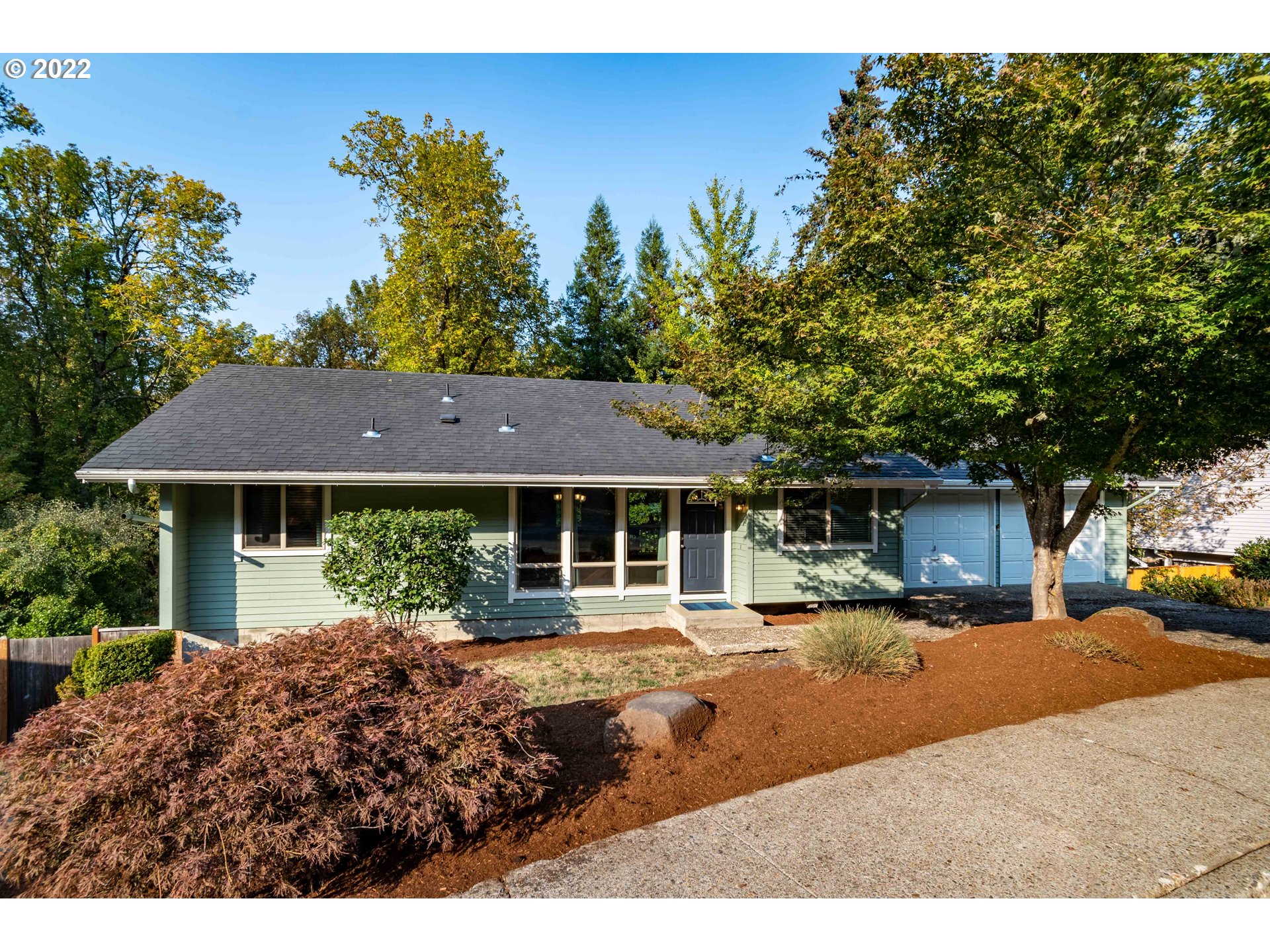 Beautifully Updated, Light-Filled & Move-In Ready Home in Serene SW Eugene Neighborhood! Open concept design featuring spacious living & dining w/ laminate floors leads to remodeled kitchen w/ white shaker cabinets, quartz counters & stainless GE appl's. Main level primary ensuite + 3 more beds, family & laundry rooms downstairs. Huge, private fenced yard close to nature trails w/ multi-level deck & covered patio. 2 wood fireplaces, newer roof, ductless heat pump, vinyl windows, appliances incl.