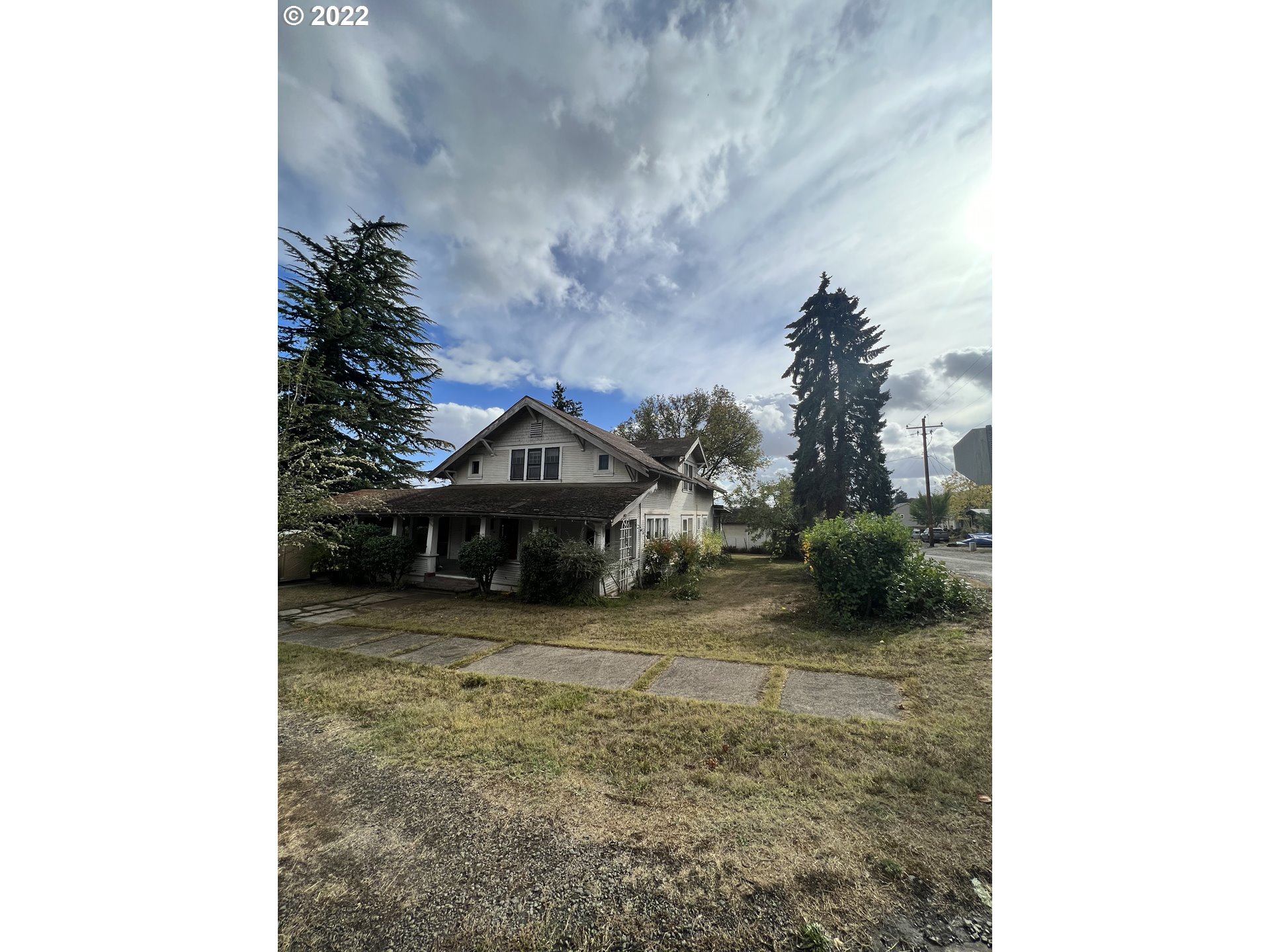 Charming 1912 Craftsman Home! This home sits on a large corner lot, The home resonates with vintage charm with the original wood floors, paneling and woodworking throughout. Spacious and 5 Bedrooms! According to the county, there is a possibility for the lot to be divided- Buyer to do due diligence. Bring your tools and fix this one up or rebuild new!