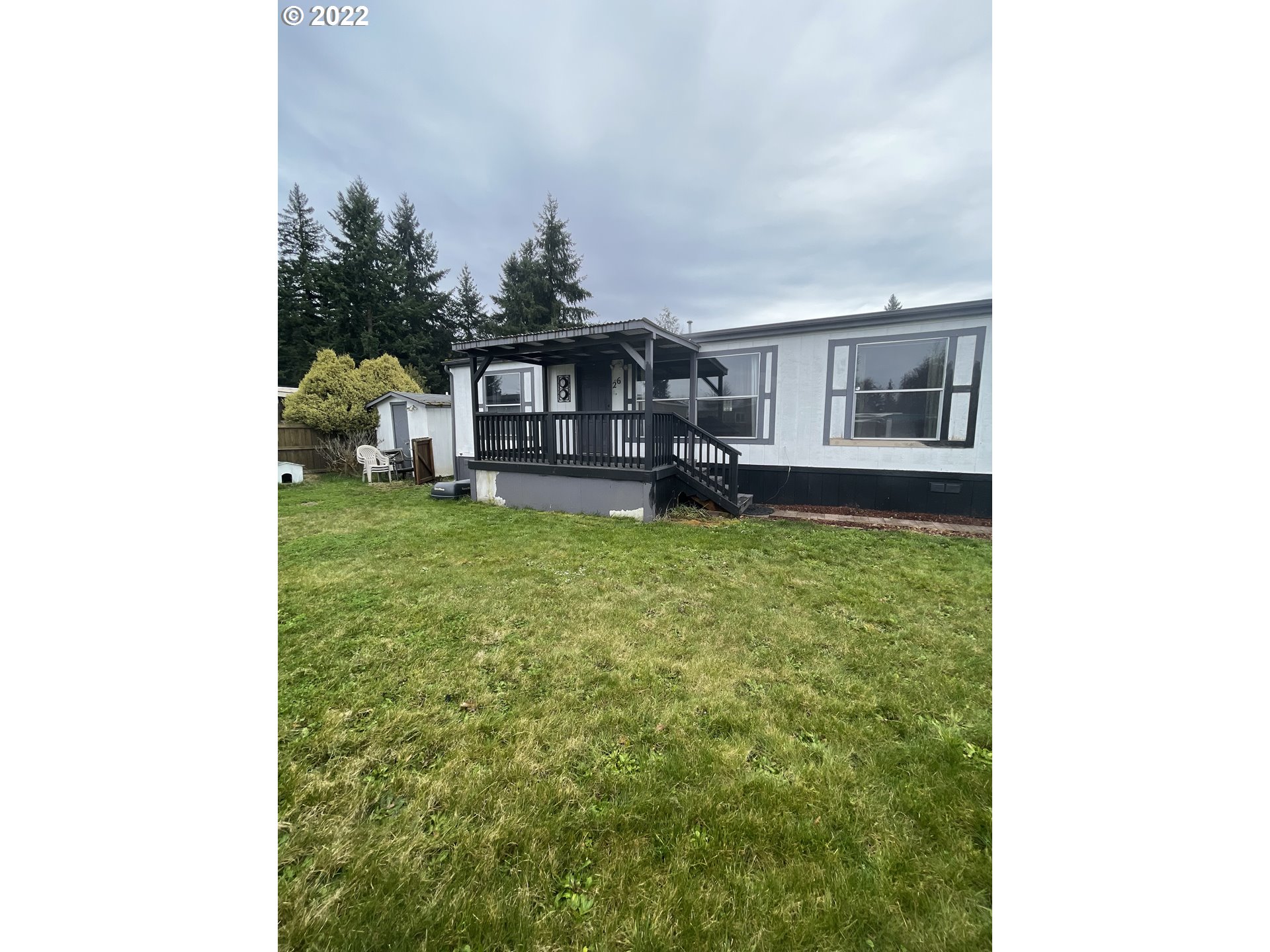Welcome Home! This Doublewide is ready for new owners! The roof is approximately 5 years old. New paint on most of the interior, new garbage disposal, new floor in the laundry room. Fridge & Full range and desk in the bedroom included. Newer backsplash in the kitchen as well. This home wont last long! Come see it today!
