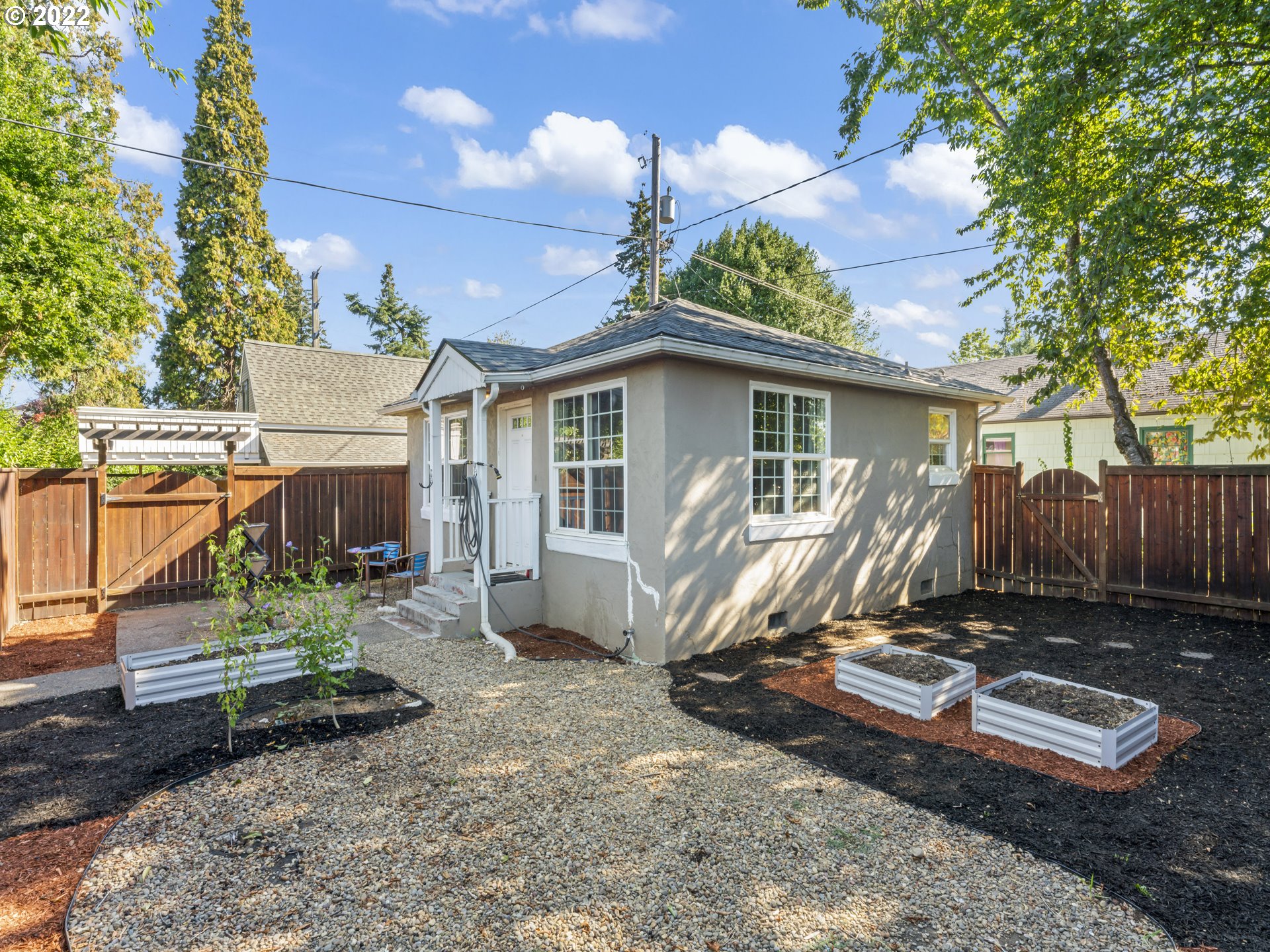 Welcome to your unique cozy cottage compound! Detached on it's own land, NO HOA DUES! Fully fenced in privacy and garden space. Light, bright and in a fantastic location! Newer roof, leaf filter gutter system, quartz countertops, Gas stove, vinyl plank flooring and instant hot water! Minutes from Downtown, Lane Events Center, bike/walking trails and grocery stores. Perfect starter home, AIR BNB, vacation home, unlimited possibilities!