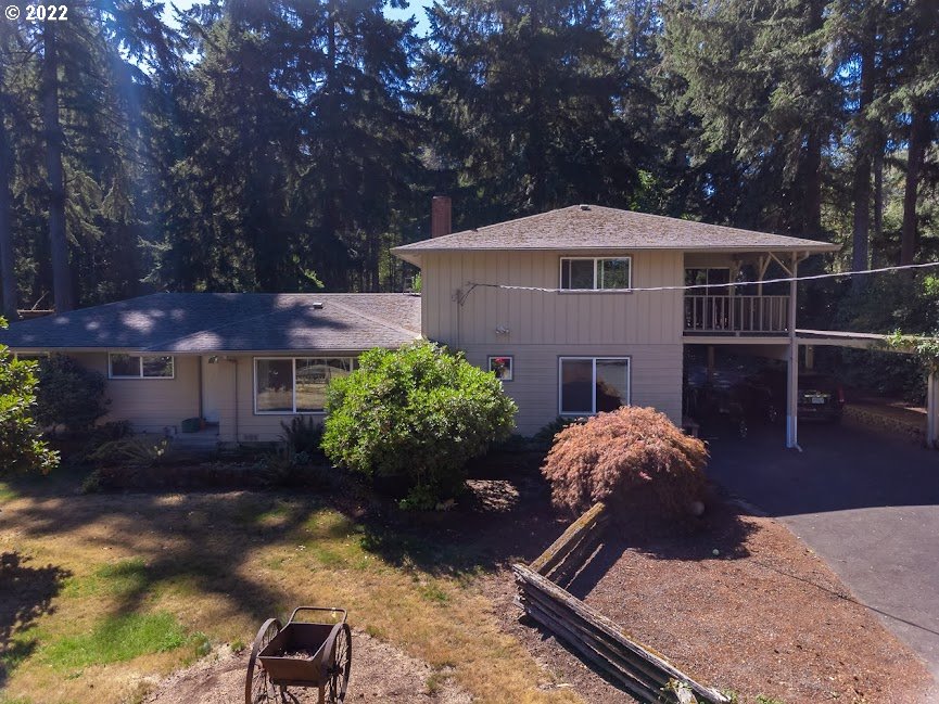 Have the country feel on nearly 2.25 level acres but be just minutes from Eugene and Springfield, near I-5. Enjoy soaking in the jetted tub in downstairs bathroom or relaxing in the family room next to the woodstove. This home has a large, covered RV/Boat storage as well as a carport. Relax in the backyard, under the large shade trees while feeling the privacy from surrounding neighbors or play around in one of the outbuildings working on projects. This home has a newer roof, windows and siding.