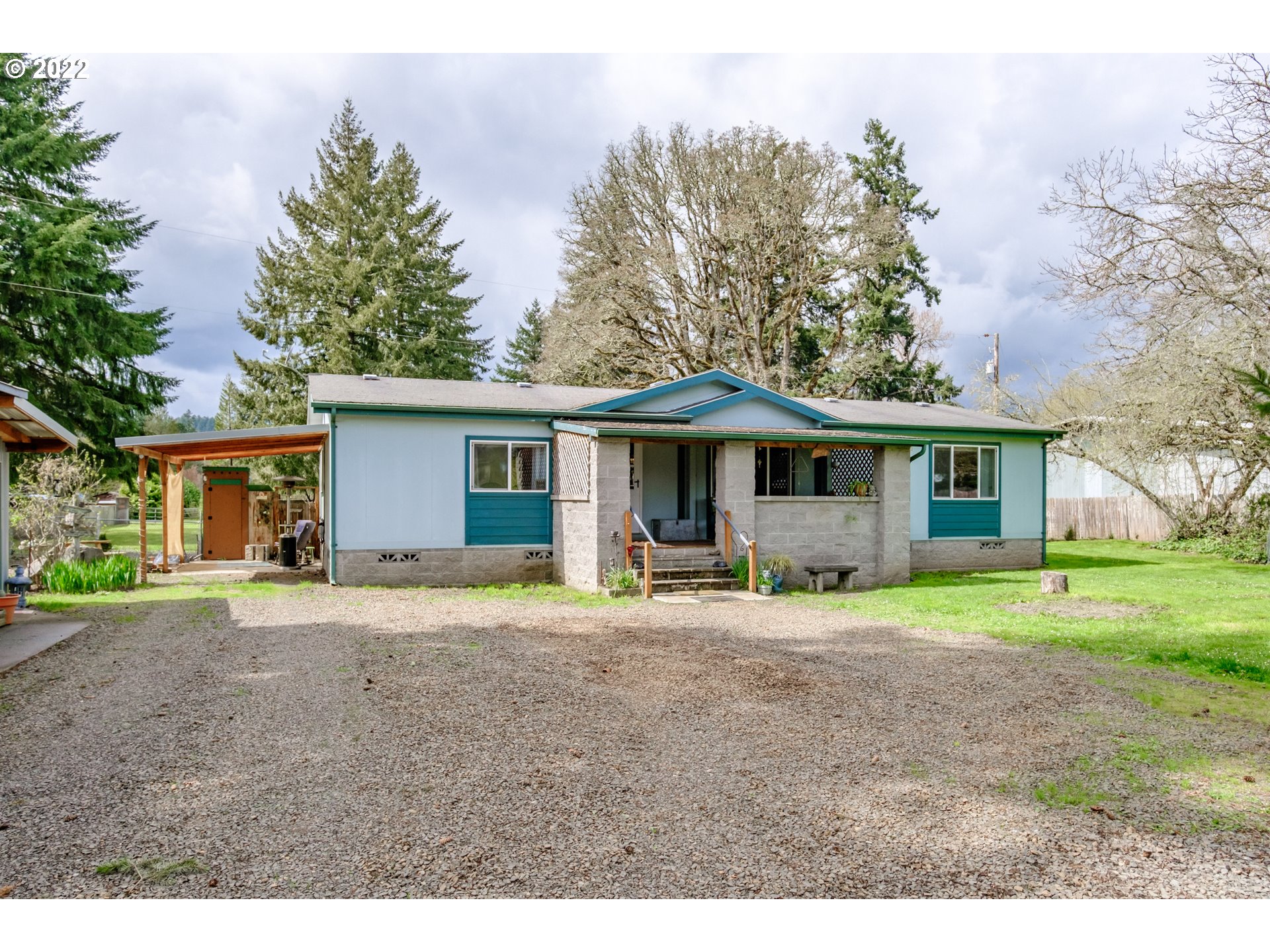 Enjoy country life in this updated manufactured home on 0.88 acre with a shop, two picturesque covered porches, & gorgeous flat property. This home is move-in ready & features large bedrooms, a soaking tub, & big closets. Create your dream hobby farm, enjoy plenty of space, and throw the best get-togethers. Can be sold with the adjoining commercial lot currently rented by the Crawfordsville Post Office, for sale for $125k, but it's not required.