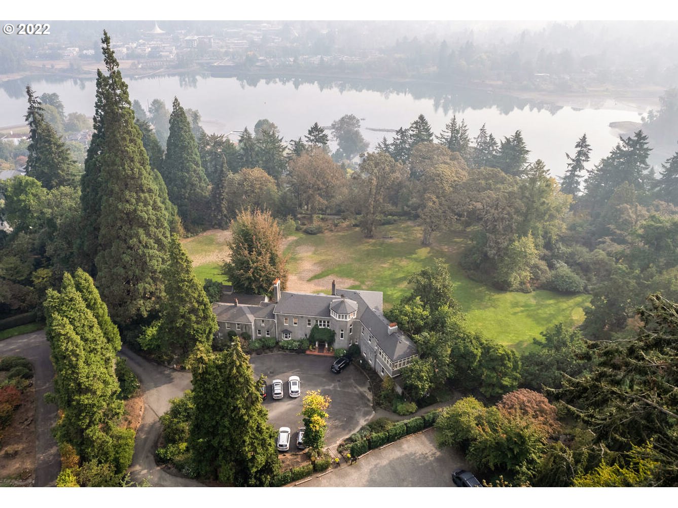 Presented to the market for the 1st time - simply nothing like it in the Portland Metro! This unique jewel offers almost 9 acres of exquisite English gardens & river-view walks. The grand main residence features Mt Hood views, rich millwork, soaring ceilings, vast dining hall, guest qtrs, and is currently in use as Diocese offices. Develop this unequalled parcel, restore the home to its original splendor, or create your custom vision in the heart of beloved Dunthorpe. Top Riverdale Schools!