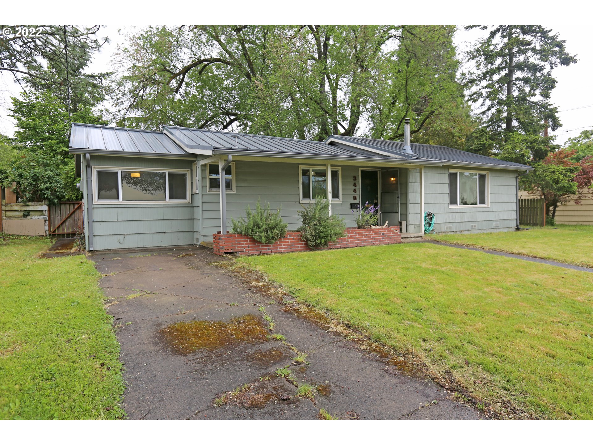 Don't miss the opportunity to own in beautiful South Eugene! This three bedroom, one bathroom home has painted hardwood floors, plenty of character, coved ceilings, a fenced back yard, an indoor utility room, a detached 2-car garage/shop with 220 electrical, and alley access. Garage/shop has a fireplace and a patio with a built-in barbecue, and it's own electrical panel.