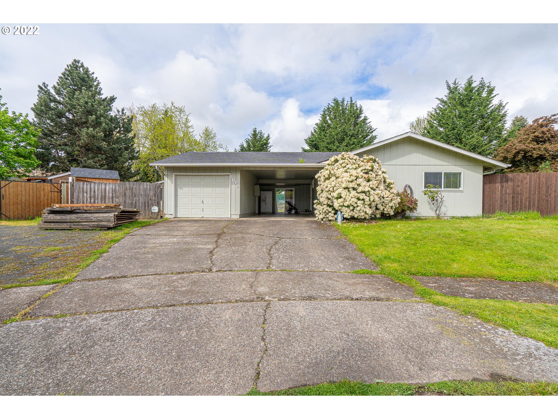 Single level home with NEW roof! This home can be 2 or 3 Bedrooms (if den used as bedroom.) Large fenced back yard on .24 on an acre in a cul-de-sac with RV PARKING! Back yard inludes, dog runs, fenced garden, roomy lawn, and a covered patio. Seller has engineered plan to on to in the future. Home is in Lovely condition. Single car garage with 12 x 18 Shop,and Big enclosed Carport. open house 5/14 2:30-4:30& 5/15 2-4pm
