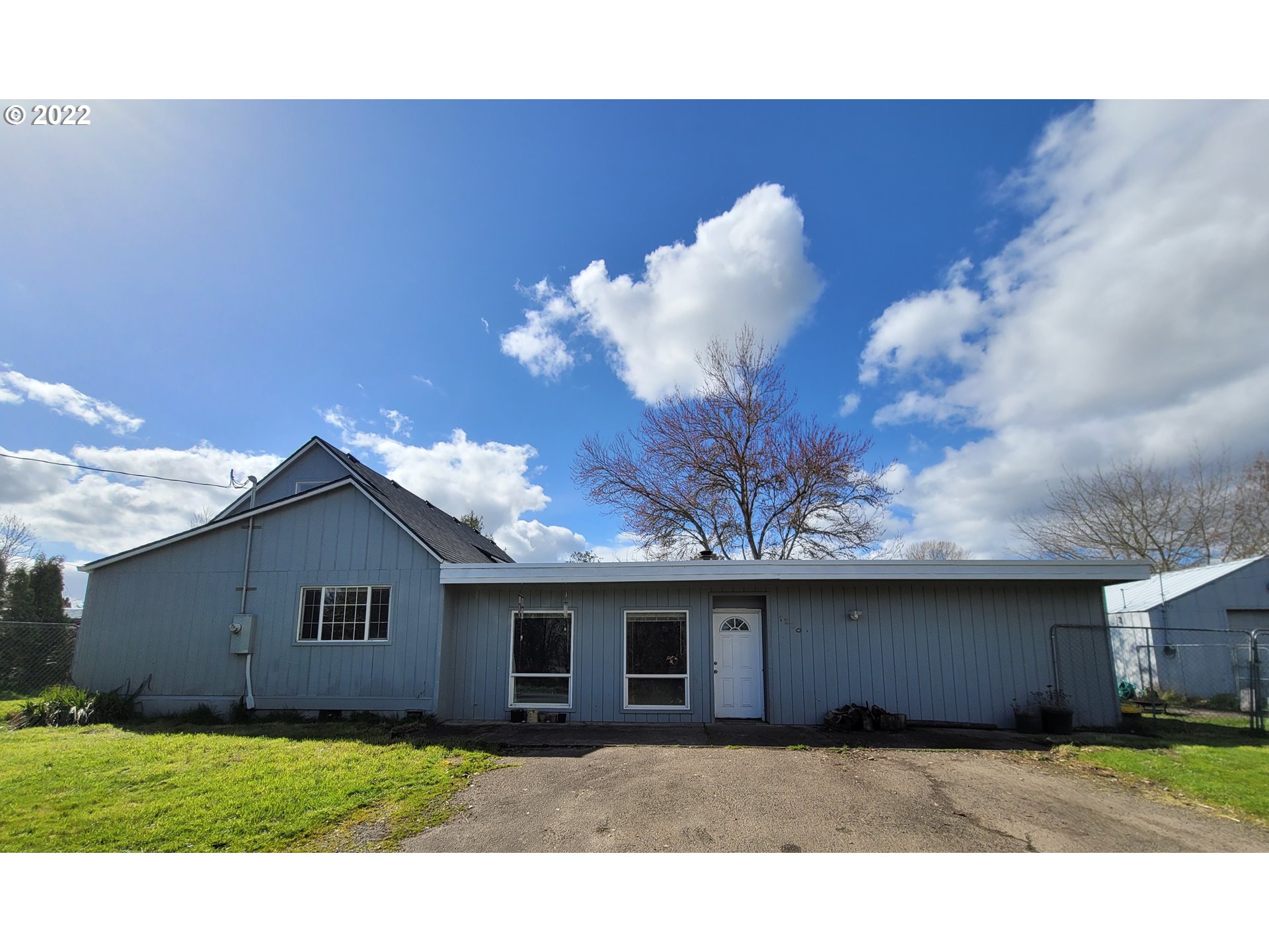 Opportunity abounds in this home w/ rental, multi-family, or home biz potential! This 2884 sq ft home on nearly 1/2 an acre has 6 bedrooms & 4 baths spread b/w the main home & 2 extra attached 1 bed/1 bath units w/ own ext. entrances, one w/ a kitchenette & the other ready for one. Big primary bedroom has a private bath & walk-in closet +3 more bedrooms,1 bath, & bonus space in main home. All this + 1000 sq ft shop w/ power on own elec. panel. NEW roof in 2020! Bring your imagination & offers!!