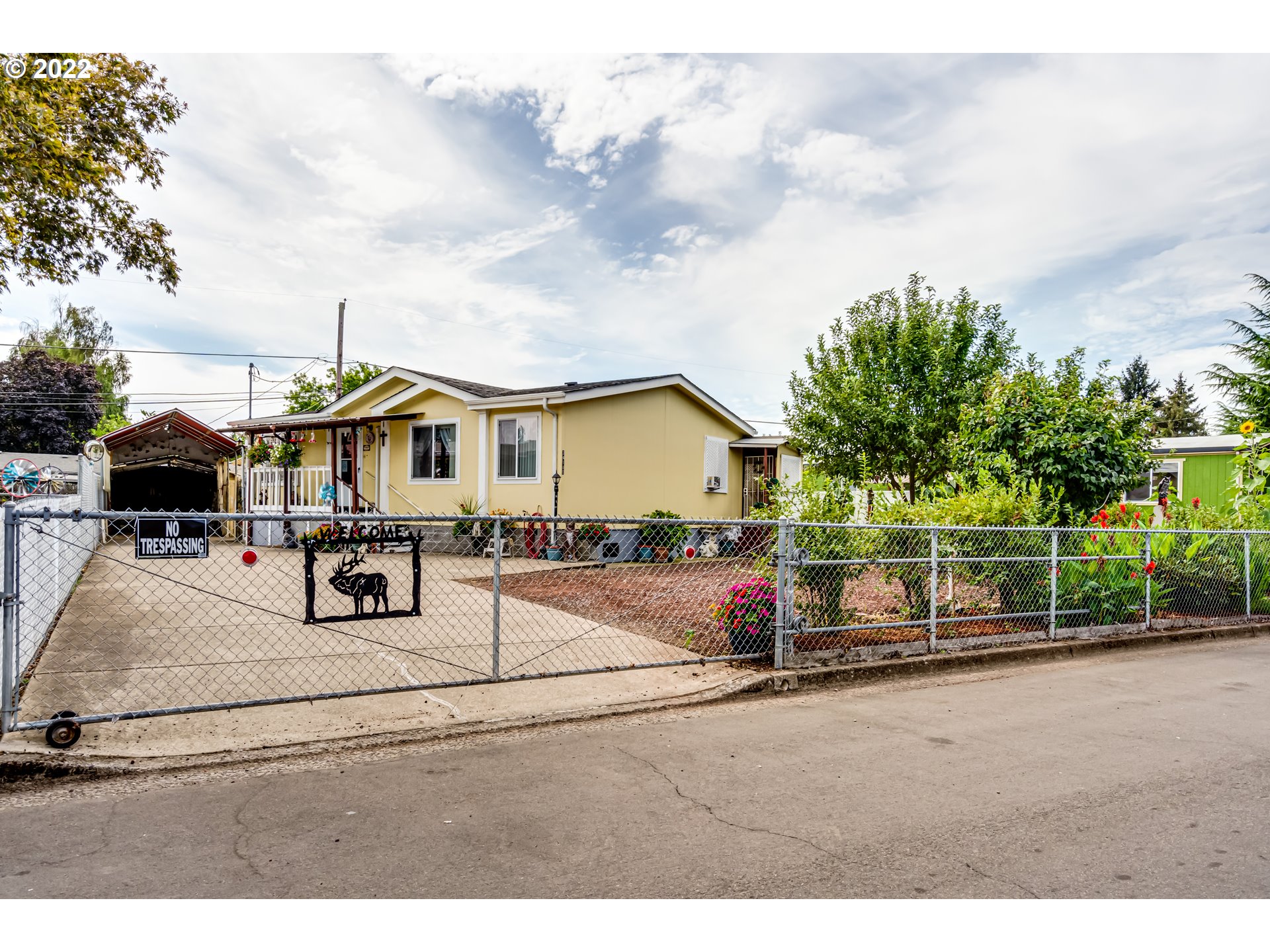 OPEN 1-3PM 9/25- Home ownership at an affordable price with low property taxes . This charmer features spacious layout with vaulted ceilings, new roof, floors & ductless system. Fully applianced, includes W/D, closed in patio with lots of space for storage and pantry. Fully fenced with a gate & tool shed, oversized carport/RV storage, beautiful garden with lots of vegetables, flowers and fruit trees. Community well water only $20/month. Quiet neighborhood, convenient location with Great views.