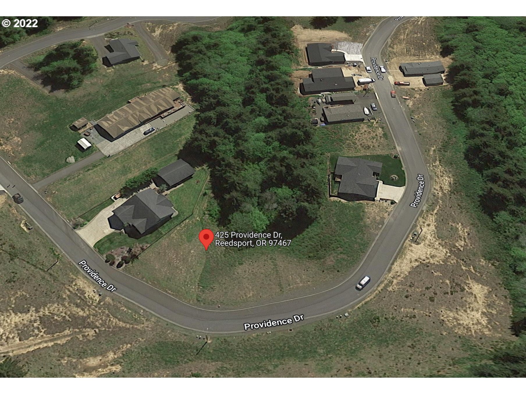 Fantastic opportunity to secure one of the few remaining lots in Providence Subdivision in beautiful Reedsport, perfectly located on the Central Oregon Coast at the confluence of 3 rivers. This newer neighborhood is perched above Forest Hills Country Club, blocks from Lower Umpqua Hospital, schools, & very near the breathtaking Pacific Ocean. Custom engineering & architectural plans for 2-story home & shop, designed to maximize your use of the site, included or a manufactured home may be placed!