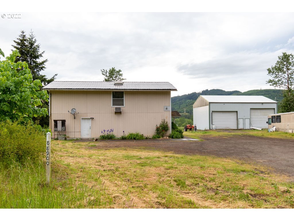 3 acres less than 3 miles to the freeway at 42nd St. 38x48ft shop with 14 and 16ft roll up door, 220v, 200amp and 3-phase power. Home is about 1700 sq ft. Property is zoned Rural Industrial. Buyer to do due diligence for uses