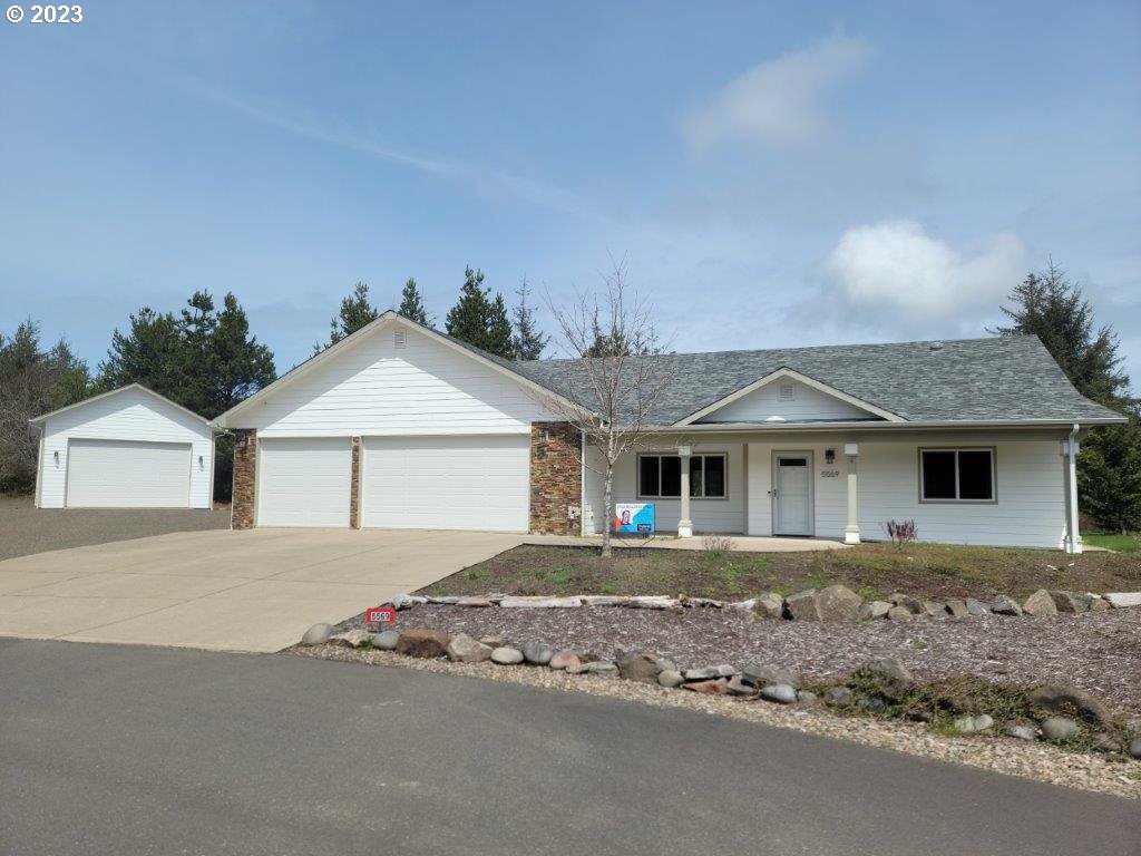 Large 3 bedroom 2 bath home with open floor plan. Large level lot, attached 3 car finished garage, Large detached heated garage.  Comfortable living with granite counter-tops, tile and carpet flooring. Spacious living only minutes from town in quiet neighborhood. New carpet just installed