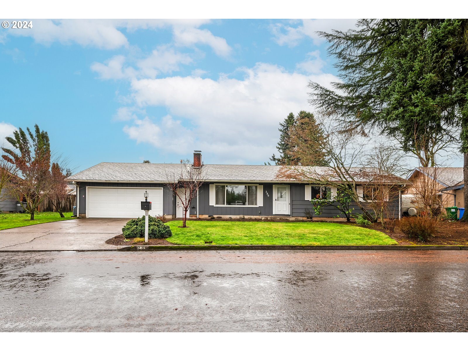 Exceptionally well-maintained single level home in Eugene's desirable Santa Clara neighborhood.  This home is  situated on an expansive 1/4 acre lot providing a peaceful oasis in this quiet neighborhood.  Large windows throughout the home allows an abundance of natural light flow, creating a warm and inviting ambiance. Vaulted ceilings and new flooring generate a seamless blend of functionality.  Thoughtful layout with two separate living rooms provides great separation of space. A large deck overlooking the fully fenced backyard, with an arbor and garden shed provides a dreamy outdoor gathering spot.  The established landscaping is complete with apple, kiwi, plum, flowering dogwoods, strawberries and roses. Your yard and garden will stay green and happy all year long with an irrigation well(complete with new pump) and newly installed landscape irrigation.  The additional living room with it's own entrance, provides a unique opportunity for a potential extended living situation. Don't miss out on this fantastic opportunity! Open house Saturday 1/27 and  Sunday 1/28 from 12-2.