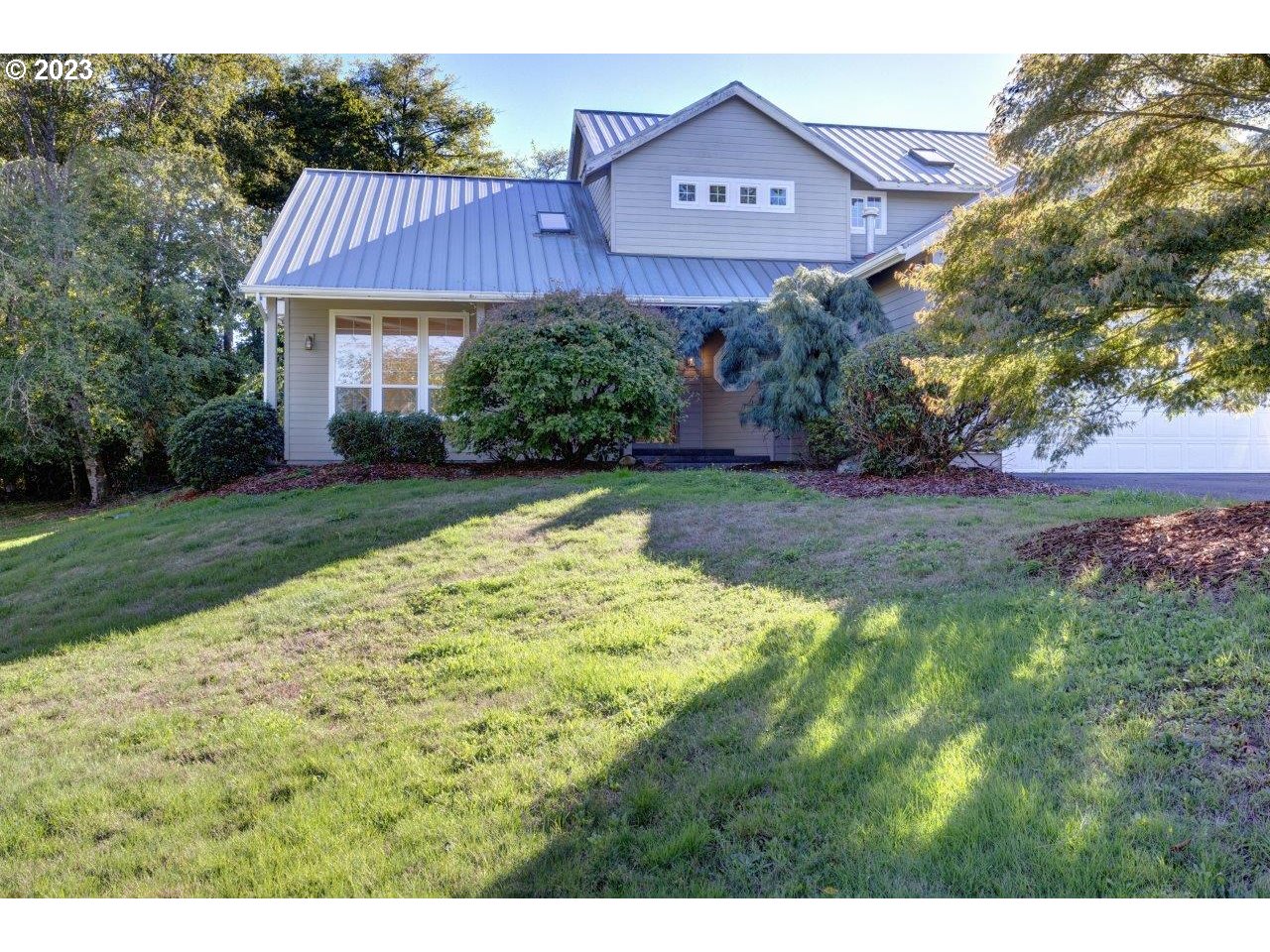 42410 BAGLEY LN Astoria, Oregon This is it! Country living in a home with a back yard that is a slice of heaven w/ an additional adjoining lot offering 1.26 Acre total of property. This 3 Bedroom, 3 bath home awaits, primary bedroom includes lots of closet space, private bath with jetted tub, and gas fireplace. Large kitchen, 2 dishwashers for entertaining,2 ovens, all SS appliances, & large pantry. Gas fireplace in the living room, high ceilings create a feeling of open space, sliding glass doors to the patio. Large patio has a woodturning fireplace, a pond, and beautiful landscaping, wiring is installed for a hot tub on the patio. Don't miss out on this captivating home. Schedule a private tour today!