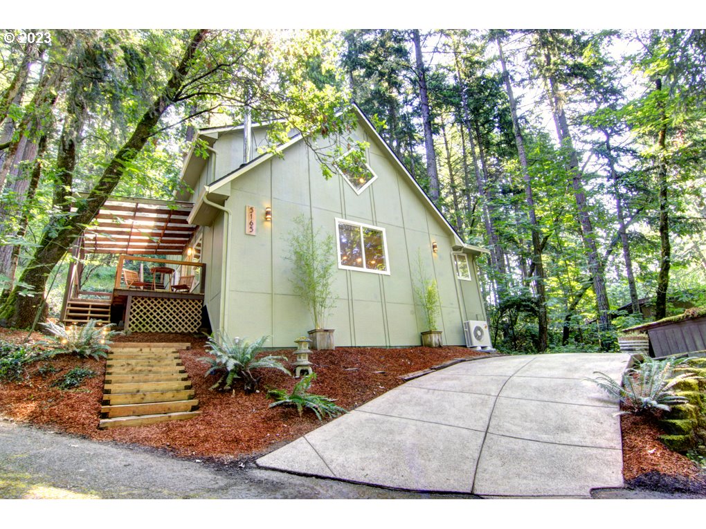 One of a kind newer construction home in the solitude of the south hills. If peace and tranquility are what you are looking for this is the home for you. End of road privacy in the woods adjacent to the Ridgeline Trail system. Listen to the birds and the gentle breeze in the trees, the only sounds you'll hear. Uniquely designed home design built in 2000. Vaulted ceilings with wood accents throughout. Both upstairs bedrooms have exterior doors to the peaceful back deck. Hike from that deck into the woods, that are city owned, that join the Ridgeline Trails. Updated kitchen with quartz counters, all new stainless steel appliances. Freestanding wood burning fireplace for cozy evenings. New ductless heating/cooling system. Updated bathroom with quartz counter. Covered front porch to enjoy the sunsets and the sounds of the evening. Newer washer/dryer included. 216 sqft shop on the main level is powered and has additional storage. Back deck has power for a hot tub. Come fall in love with your new home. Everyone who visits, does. Owner is a licensed real estate agent.