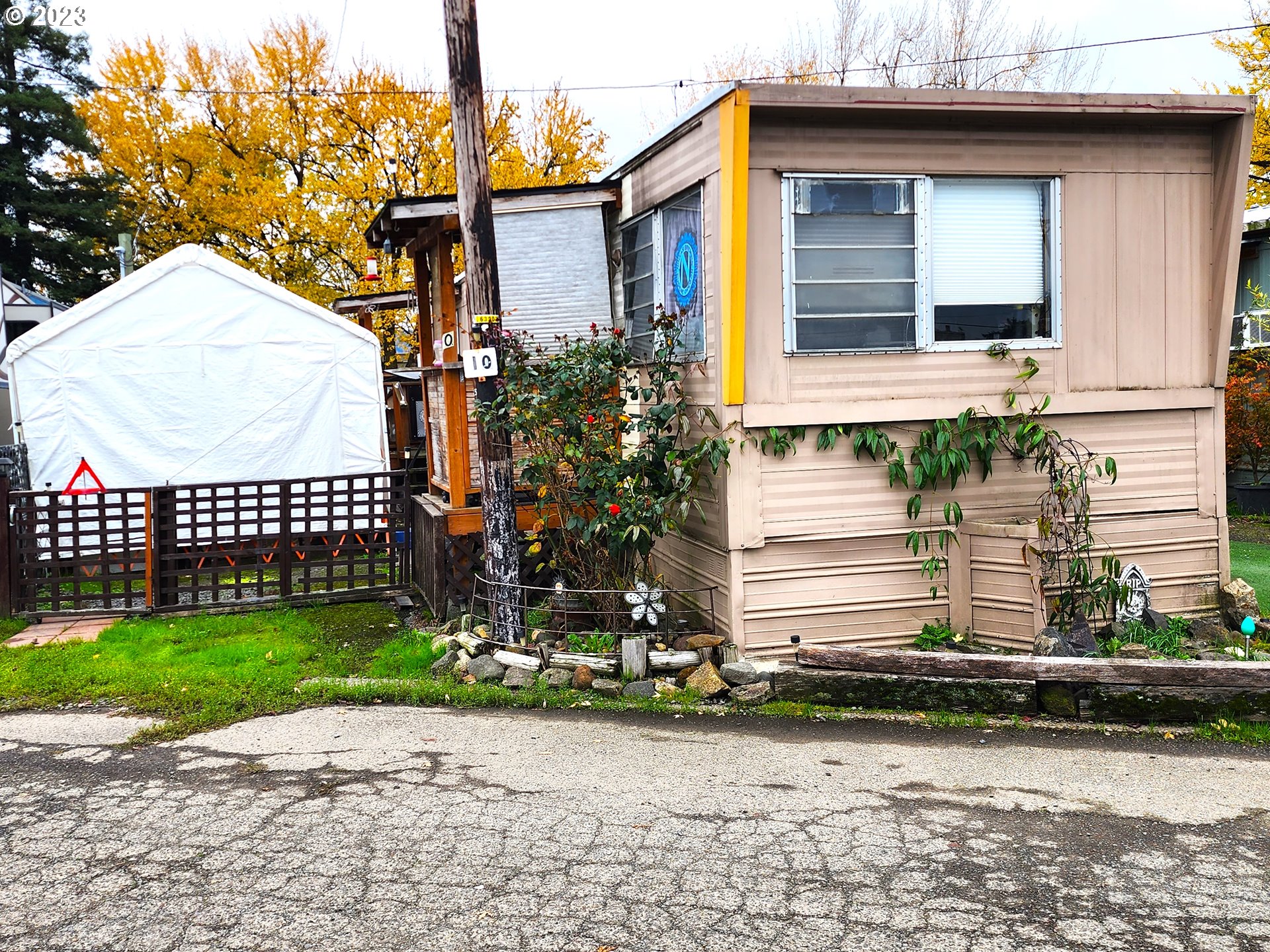 Nestled in a small mobile home park, this unit is a cozy 2 bedroom 1 bath unit is ready for a new owner occupant or investor for a rental. Kitchen comes equipped  with a fS refrigerator and space and 220 outlet for a range. Close to shopping, bus line, hospital, schools.