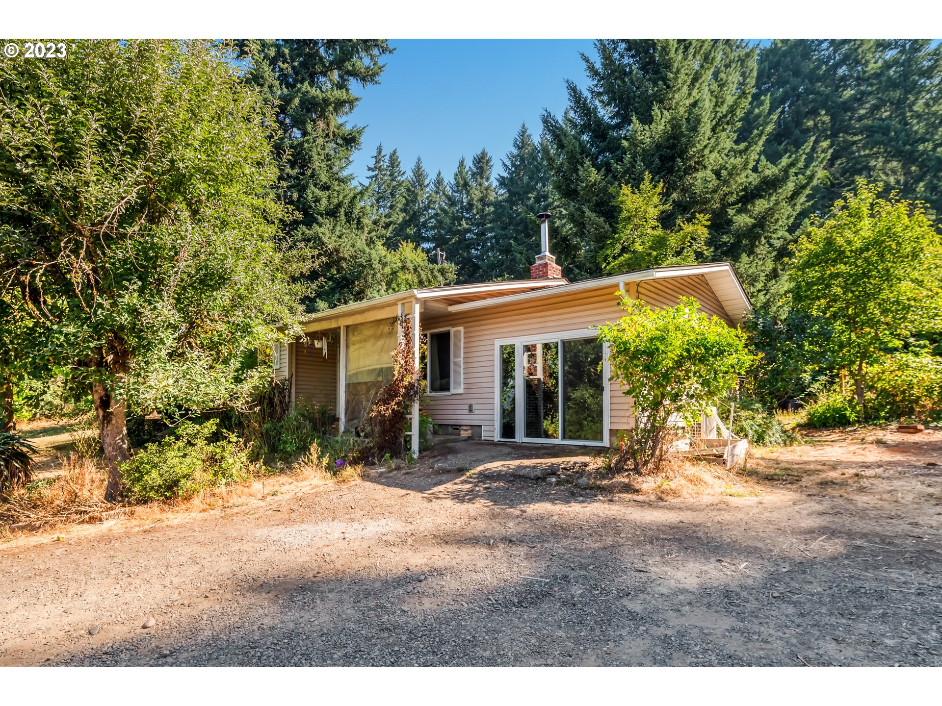 1750 Hillside DR Cottage Grove, Oregon Nestled on a generous 0.67-acre lot, is a 3-bedroom, 1-bathroom home. This property offers a comfortable and convenient living experience. Kitchen Elegance: The heart of this home is its remodeled kitchen, showcasing new cabinets, countertops, and a stylish backsplash. Equipped with a refrigerator, flat-top range/oven, and built-in microwave, this culinary space effortlessly combines functionality with aesthetics. Wood floors grace the living room, dining area, bedrooms, and hallway, creating an atmosphere of classic elegance and easy maintenance. Stay comfortable year-round with the added convenience of a ductless heat pump, providing efficient heating and cooling options. A 30-year roof, installed in June 2020, ensures long-lasting protection from the elements. Warm Hearth: In March 2021, a certified Kuma Woodstove was added, perfect for cozy evenings and efficient heating during the winter months. The property offers a bounty of nature with apple, cherry, and plum trees, producing delicious fruits in season. Additionally, three sheds provide ample storage space for outdoor equipment and tools. While the garage features a sliding glass door and is not currently used as a traditional garage, its flexible layout offers endless possibilities for customization. Whether as a workshop, hobby room, or additional living space, your options are limitless. There is also RV Parking.