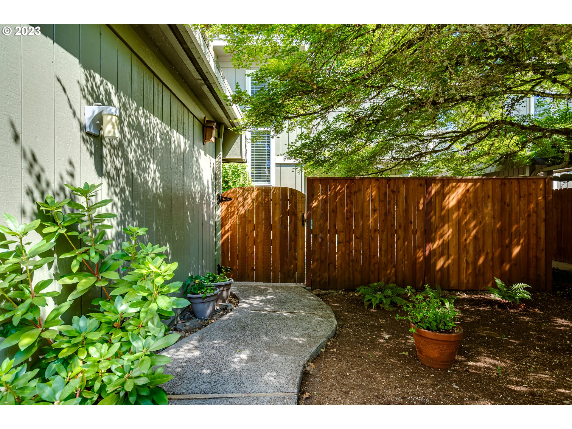 Sweet cottage feel with on-point decor. Beautifully updated kitchen with Staniless Steel appliances and sink, cultured marble countertop with 6" backsplash, new soft close cabinet fronts and drawers. New Heat/AC system installed in 2019. Darling fenced and gated private front entrance patio sitting area.  Four newer decks in back with mature landscaping privacy. Vinyl windows and sliders. Both bedrooms have ensuite bathrooms. Lovely home, move-in ready.  Great access to City restaurants and shopping centers. Community building and outdoor pool.