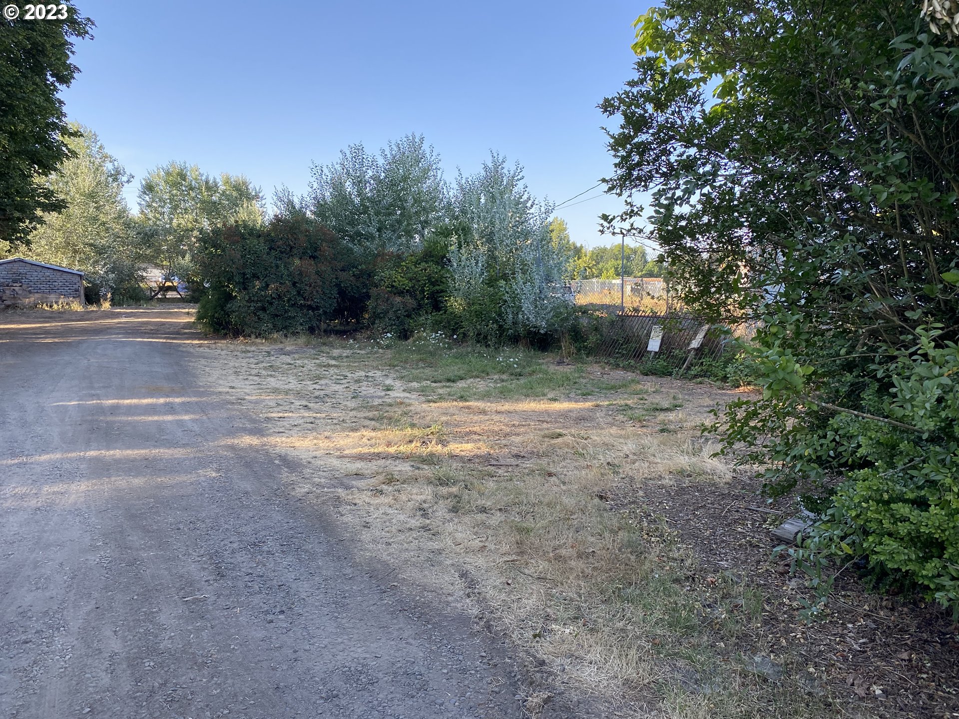 Sought after property zoned light industrial.  Zoning allows for light industrial, storage units, RV and boat storage, warehouse, shop and one residential home, buyer to do due diligence for intended uses.Structure is a former home with diminished value.  Owner-carry considered.