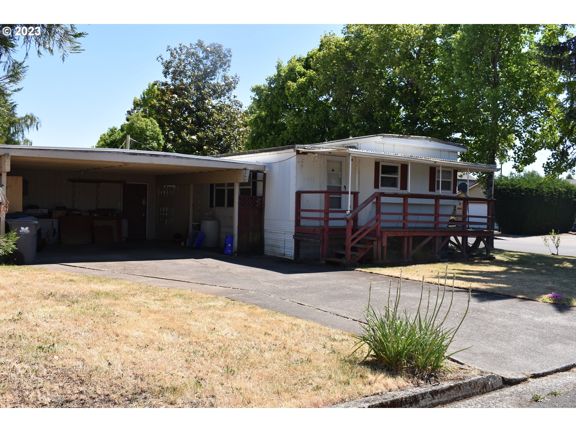 Extra Large corner lot 1969 Marlet single wide manufactured home with tip out. Covered front & back patio's. Oversized 2+ Car Car Port & Extra Storage. Updated vinyl windows through out.Lovely Back yard to enjoy those summer barbecues. Includes apple trees, grapes and storage tool shed. Affordable living. Potential for RV Parking. Own your own lot and home with out any HOA dues. Directly across from Stick built homes. Residential/Duplex potential.