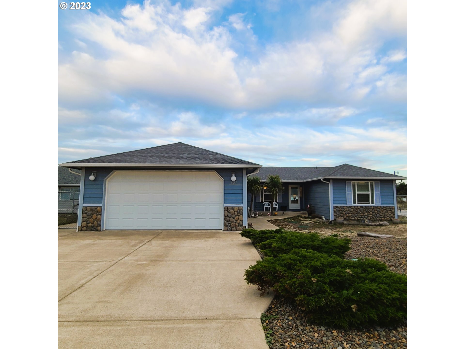 Enjoy the beautiful views whether you are inside or outside! This lovely home overlooks Alsea Bay, and the home is designed to enjoy the views! The main living area boasts a gas fireplace, wet bar, and gaming area. Open living includes a modern, well-lit kitchen with all stainless steel Frigidaire appliances and a dining area, all with open views of the bay. An oversized 8-ft slider opens to the back patio, 'Crab Shack', and steps to the bay. Great separation of space. Both bedrooms have adjacent private baths, and the primary bath features double vanities, an oversized walk-in shower and built-in seat, and an oversized walk-in closet. Interior Laundry with washer and dryer included. A separate utility room accessible from the garage is currently utilized for extras, including room for an extra freezer and refrigerator, and seasonal items. Utility sink in garage. Oversized driveway. The seller thoughtfully designed this home to be able to enjoy guests when entertaining, complete with an area with plenty of room for a pool table and incredible views, in addition to extra storage throughout the home.Wall-mounted TVs in the living room and bedroom will stay.